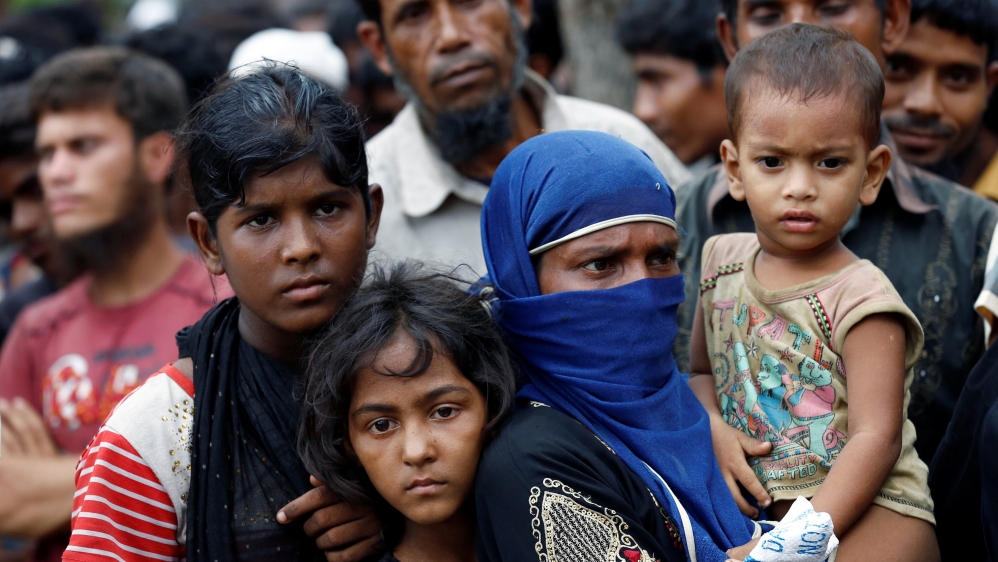 Rohingya refugees gather to collect relief supplies at Balukhali Makeshift Refugee Camp as they are affected by Cyclone Mora in Cox’s Bazar