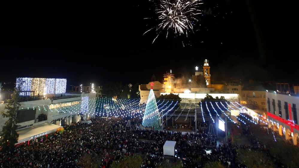 The Christmas tree lighting ceremony outside the Church of the Nativity in Bethlehem was held this year on December 2 [Reuters/Mussa Qawasma]