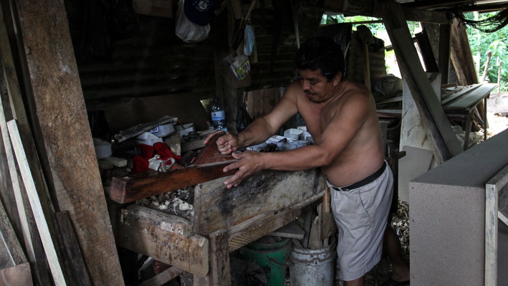 The coffin industry spans the entire supply chain, from carpenters to salespersons   [Ali Rae/Al Jazeera]