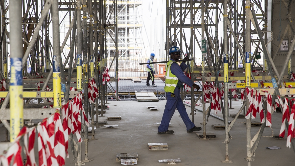 qatar 2022 labour migrant workers lusail stadium football