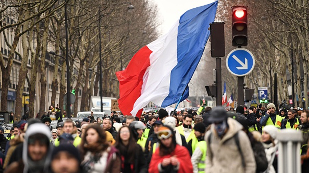 FRANCE-POLITICS-SOCIAL-DEMO People march in Paris on January 19, 2019 during a demonstration called by the yellow vests (gilets jaunes) movement in a row of nationwide protest for the tenth week