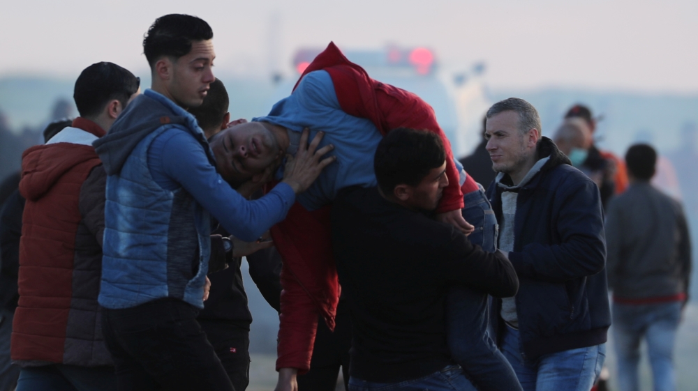 Wounded Palestinian is evacuated during a protest at the Israel-Gaza border fence, east of Gaza City
