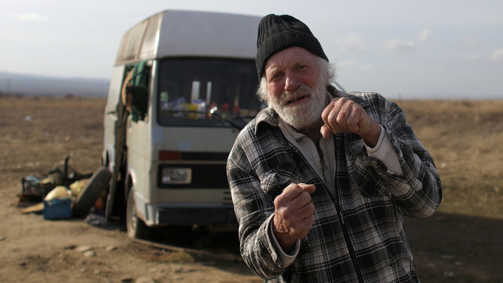 Former Dutch boxer Lubbers gathers his belongings from the van where he and his partner were living for the last eight months near Kosharitsa
