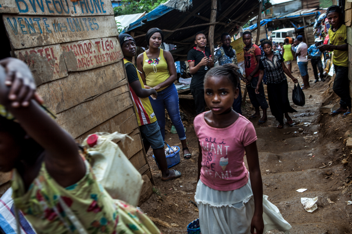 The first part of Kamituga mining site looks like a small crumbling village, where hundred shacks - turned into shops, restaurants or workshops - are squeezed against each other. Although by law child