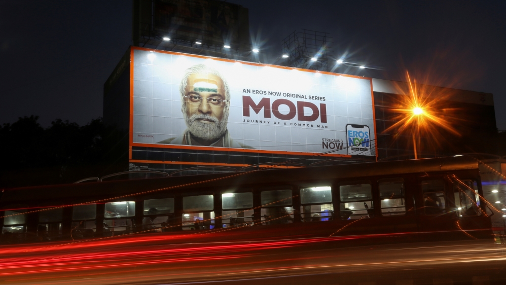 Traffic moves past a billboard of a web series "Modi: Journey of a Common Man" in Mumbai
