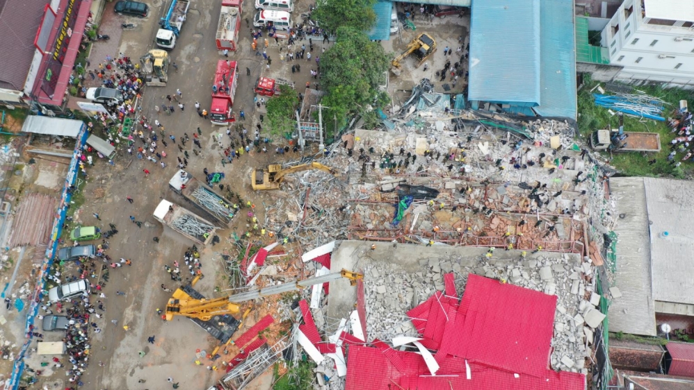 General view of a collapsed under-construction building in Sihanoukville An overhead view of a collapsed under-construction building in