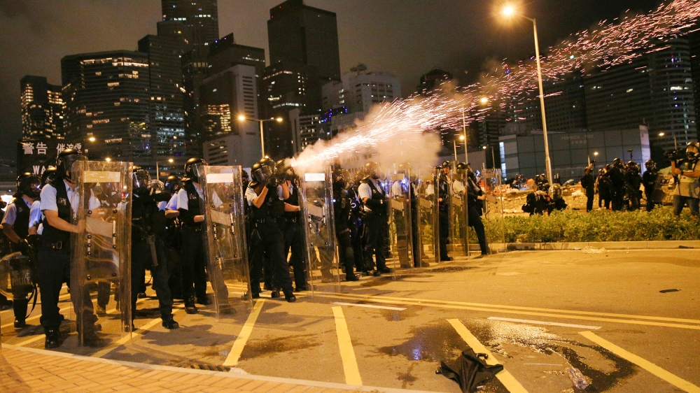 Police fire tear gas to disperse protesters outside the Legislative Council Building in Hong Kong, China, 02 July 2019. Hundreds of protesters broke into the Legislative Council Building on 01 July 20