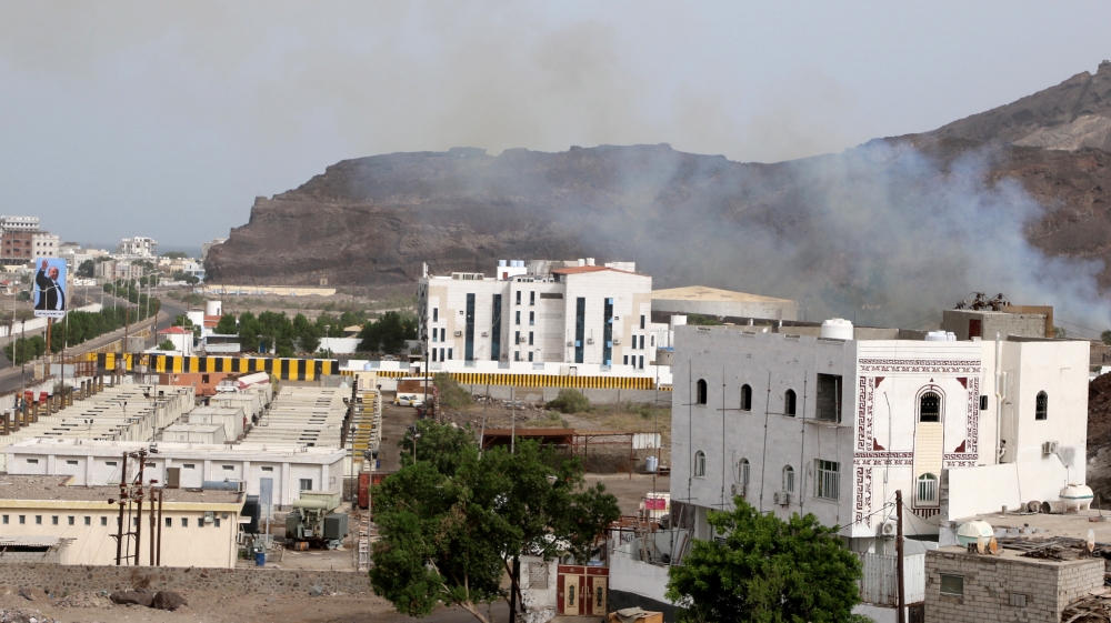 Smoke rises during clashes in Aden