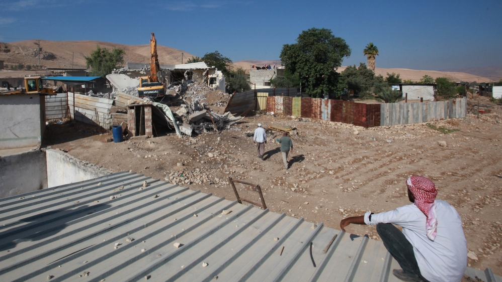 Israeli soldiers demolished three houses of Palestinians