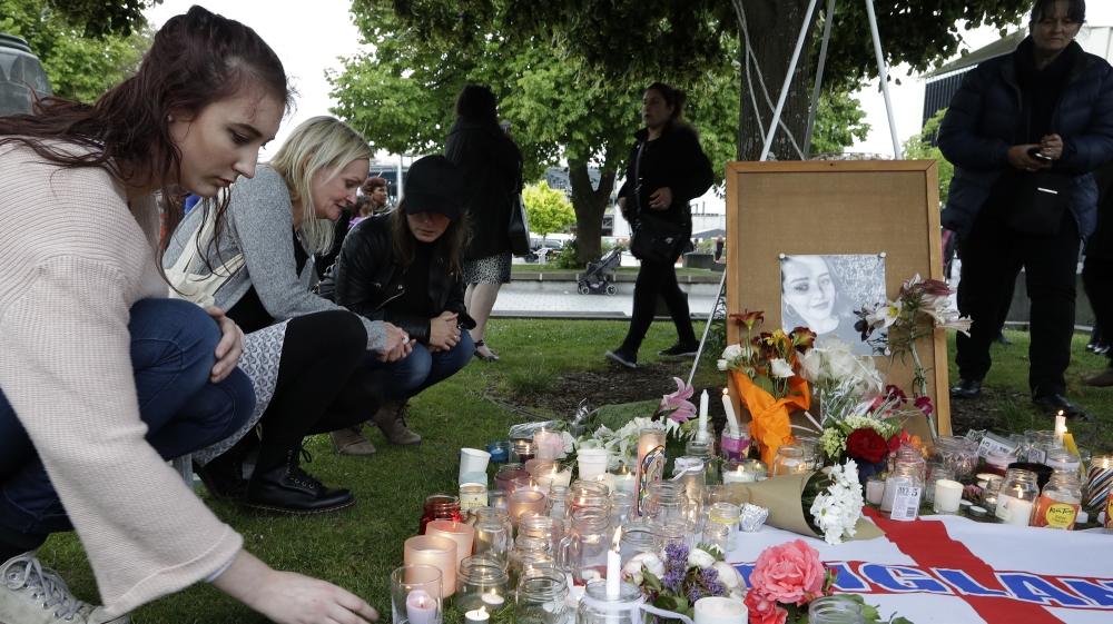 In this Dec. 12, 2018, file photo, people lay flowers and light candles during a candlelight vigil for the murdered British tourist Grace Millane at Cathedral Square in Christchurch, New Zealand