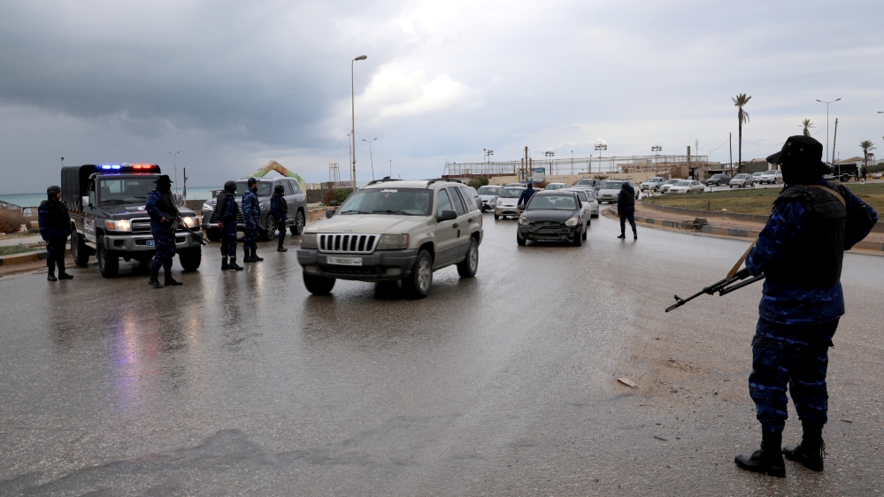 Central security support force carry weapons during the security deployment in the Tajura neighborhood, east of Tripoli