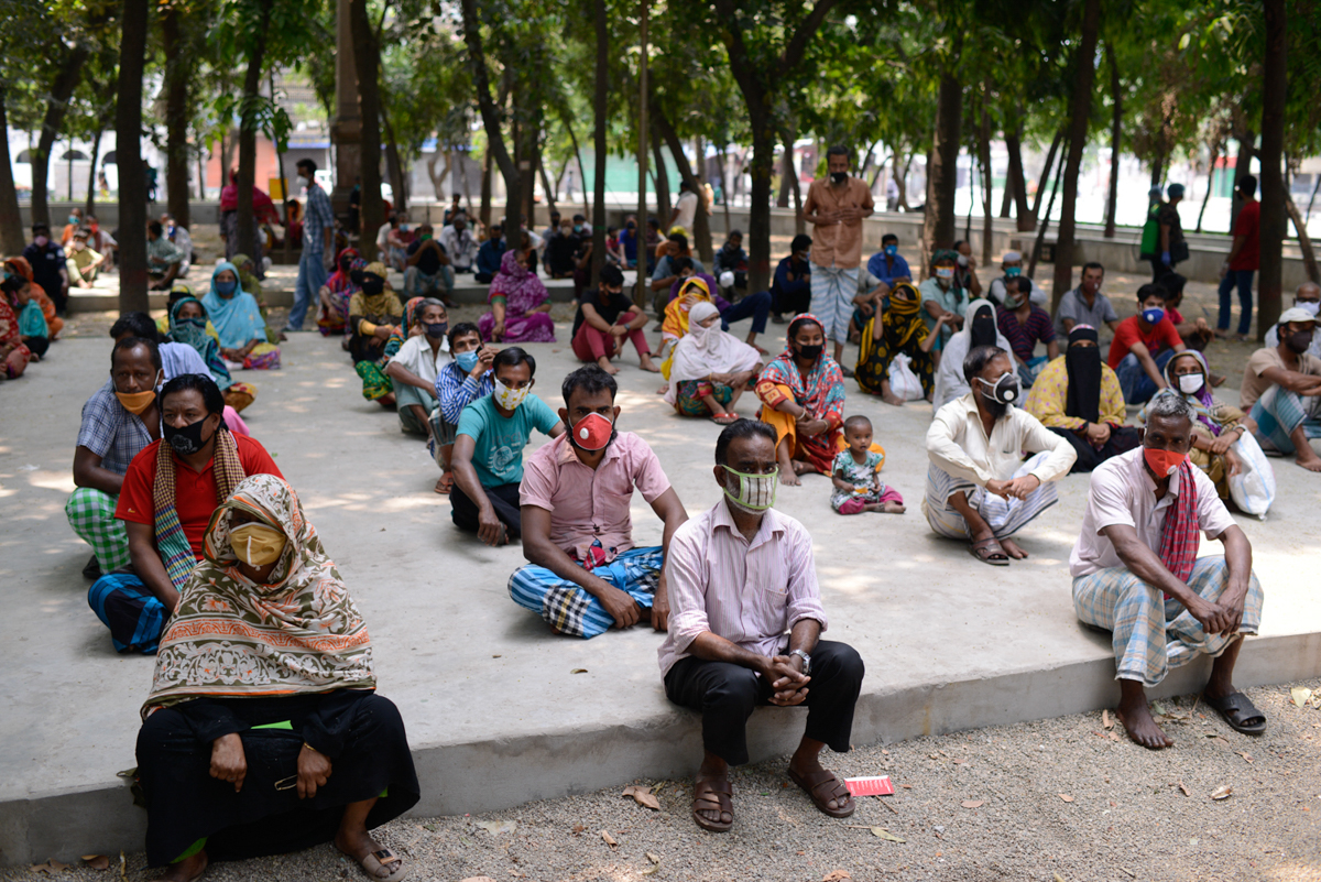 People waiting to get relief supplies provided by local community amid the coronavirus disease (COVID-19) outbreak in Dhaka. Mahmud Hossain Opu/Al Jazeera