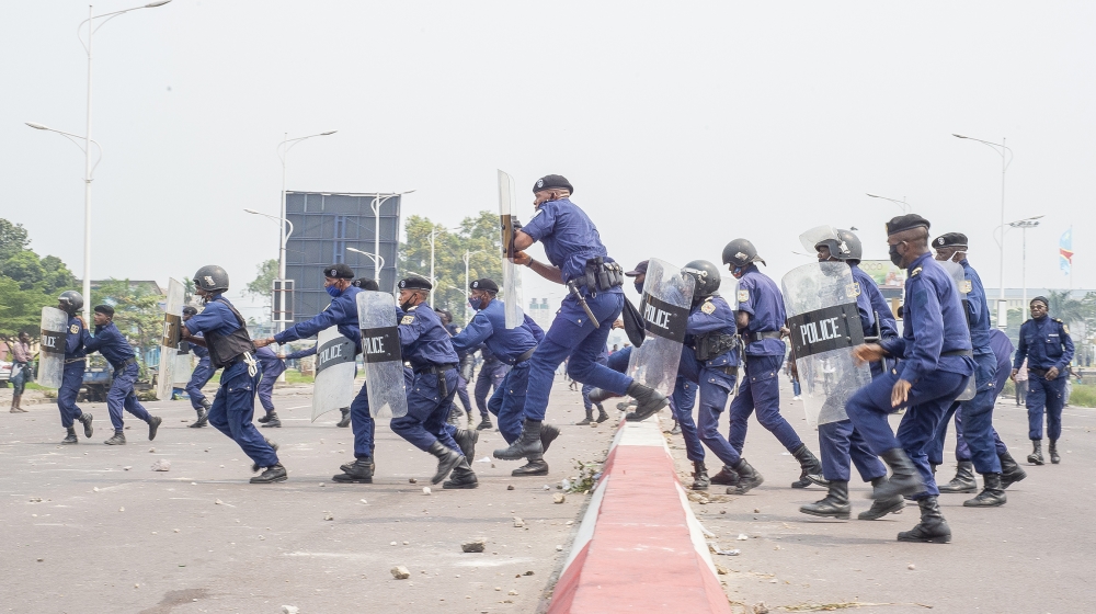 Police officers clash with demonstrators in Kinshasa on July 9, 2020 in demonstrations organized against the presidential party Union for Democracy and Social Progress (UDPS) for the appointment of th