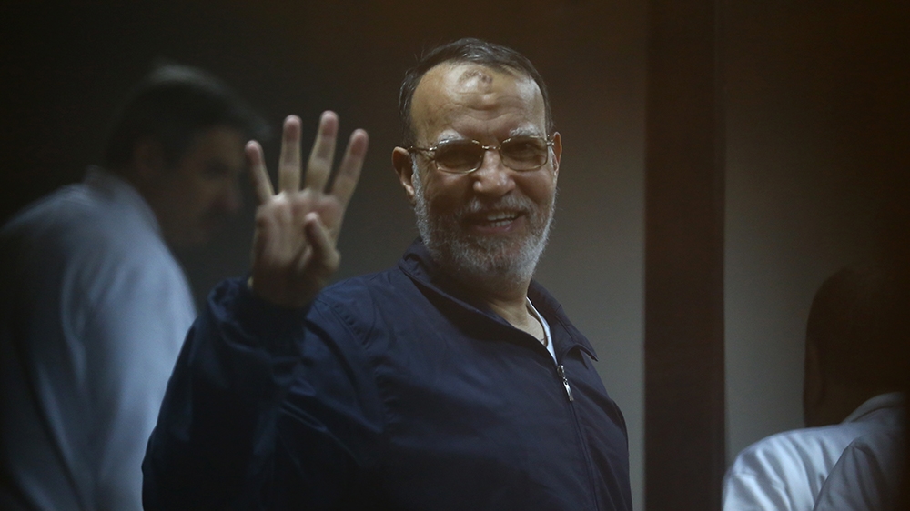 Egyptian Muslim Brotherhood senior member Essam al-Eryan stands inside the defendants'' cage during his trial at the police academy in Cairo on December 7, 2014. An Egyptian court sentenced to death fo