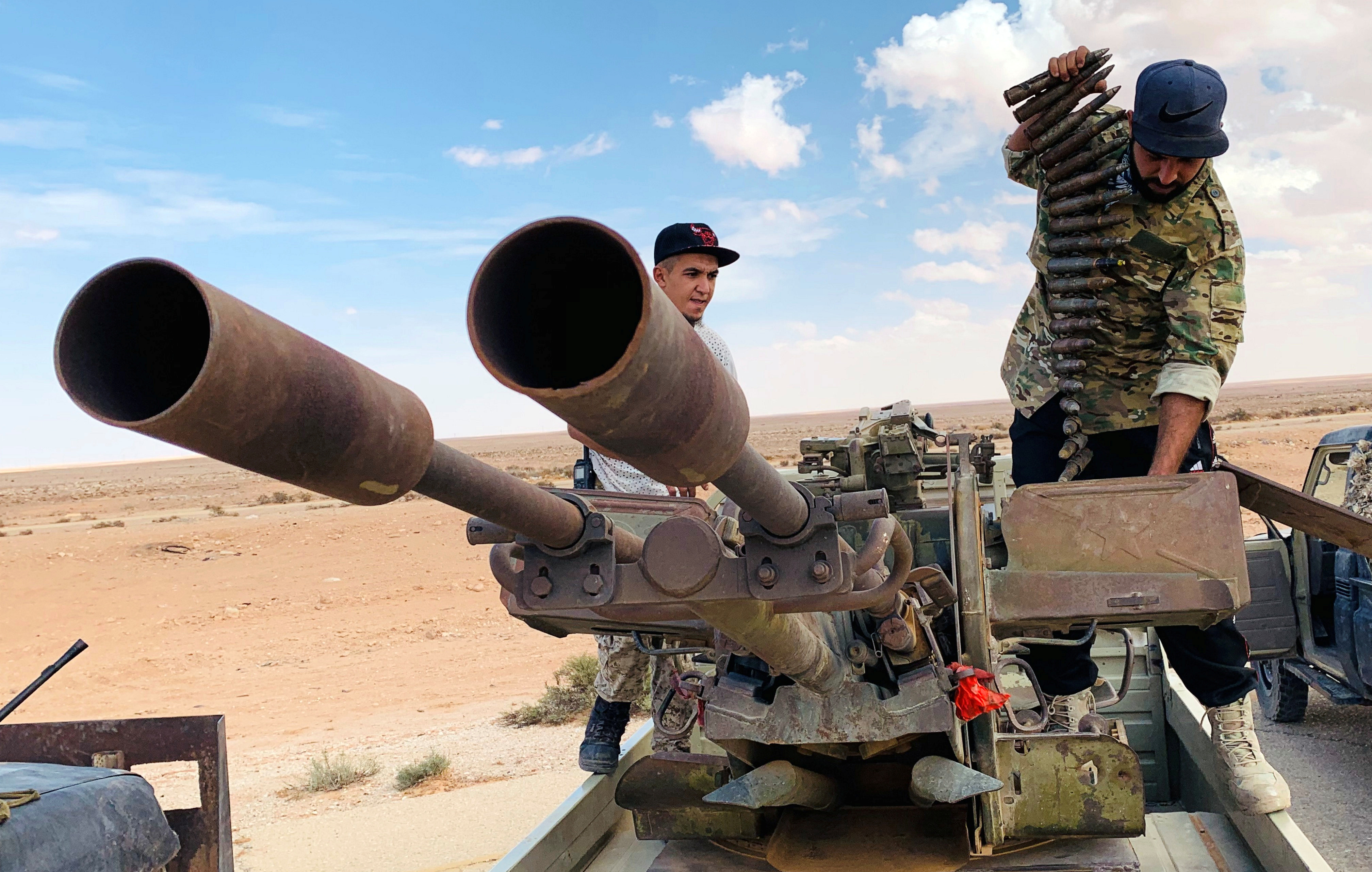 Troops loyal to Libya&#39;s internationally recognised government prepare weapons in September 2020 [File: Reuters]