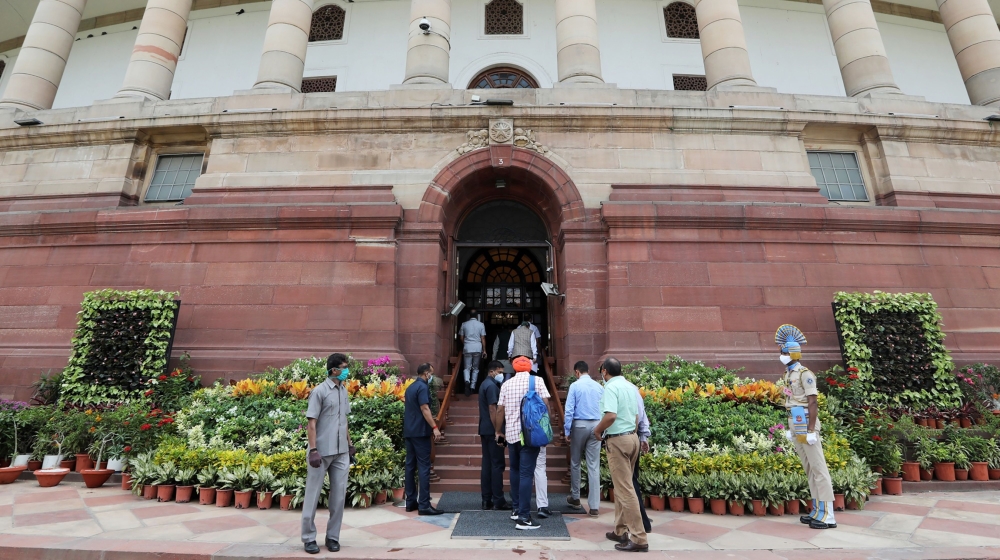 People enter Parliament House in New Delhi, India, on Sunday, Sept. 13, 2020. Indian lawmakers returned to the nation''s parliament for the first time since the start of the pandemic with Prime Ministe