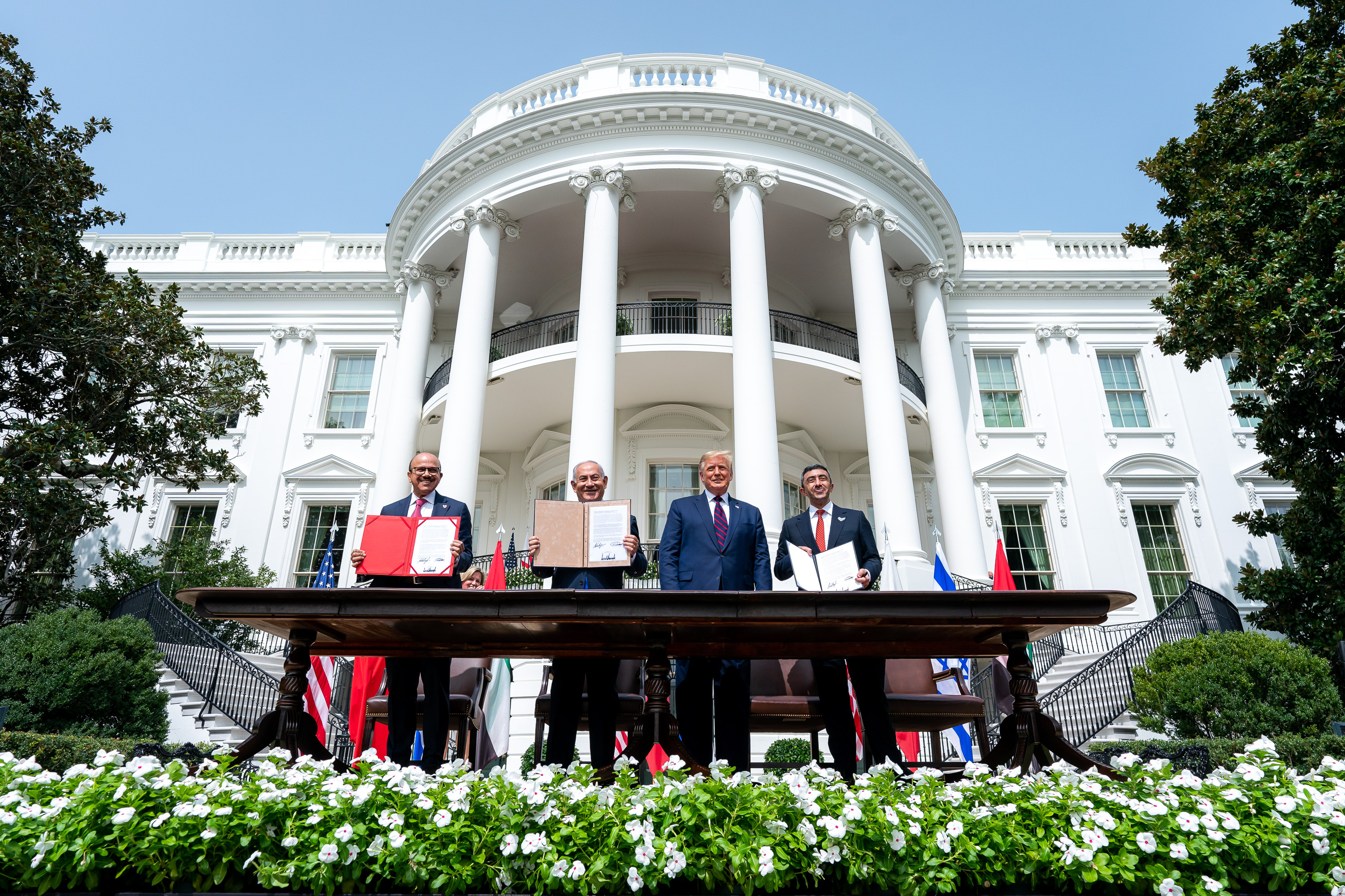 US President Donald Trump, Israeli Prime Minister Benjamin Netanyahu, UAE Foreign Minister Abdullah bin Zayed Al Nahyan and Bahrain Foreign Minister Abdullatif bin Rashid Al Zayani attend a signing ceremony for the agreements on &#34;normalisation of relations&#34; reached between Israel, the UAE and Bahrain at the White House in Washington, United States on September 15, 2020. [The White House / Tia Dufour / Handout via Getty Images]