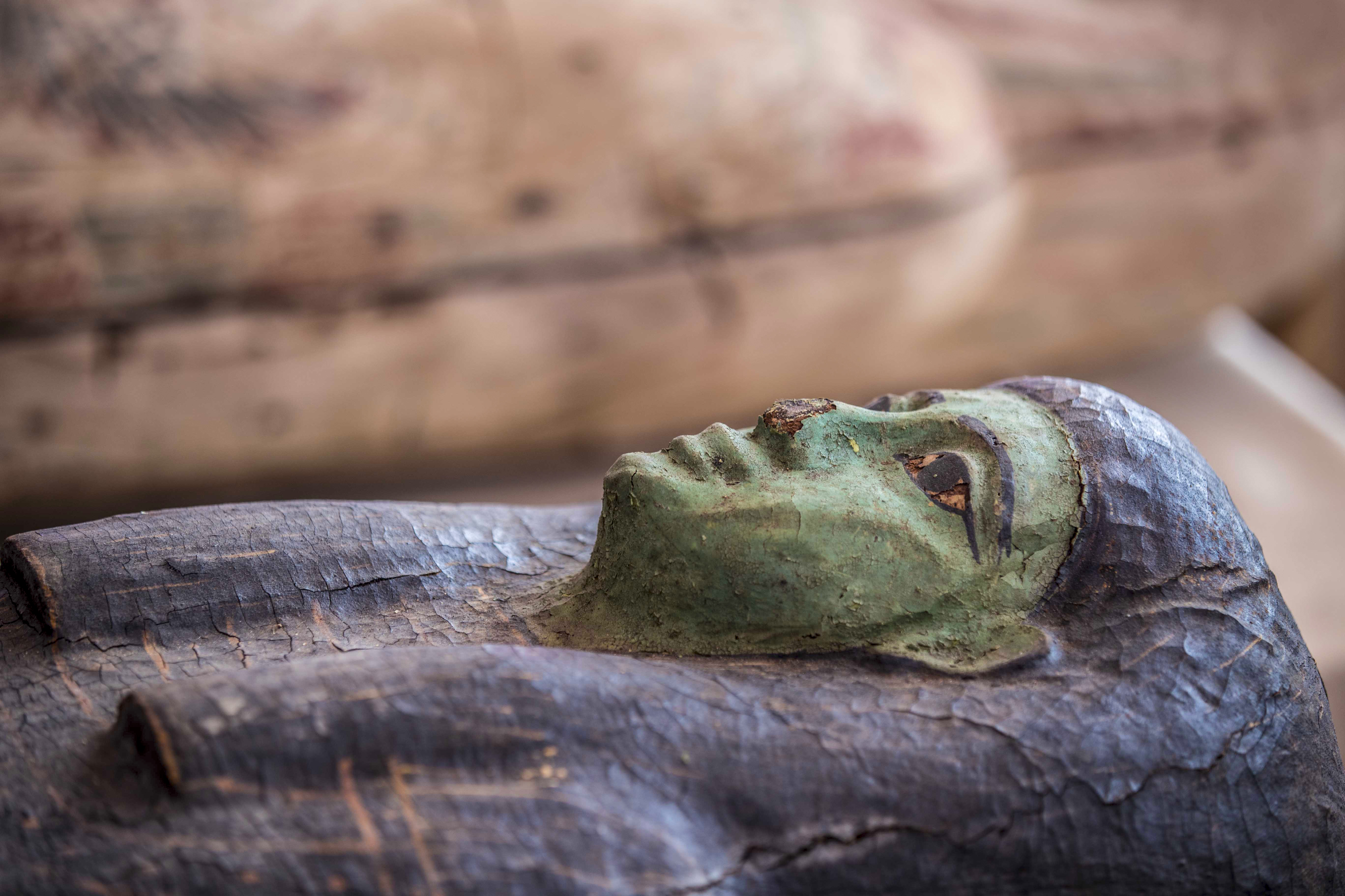 The coffins, sealed more than 2,500 years ago, date back to the Late Period of ancient Egypt [Khaled Desouki/AFP]