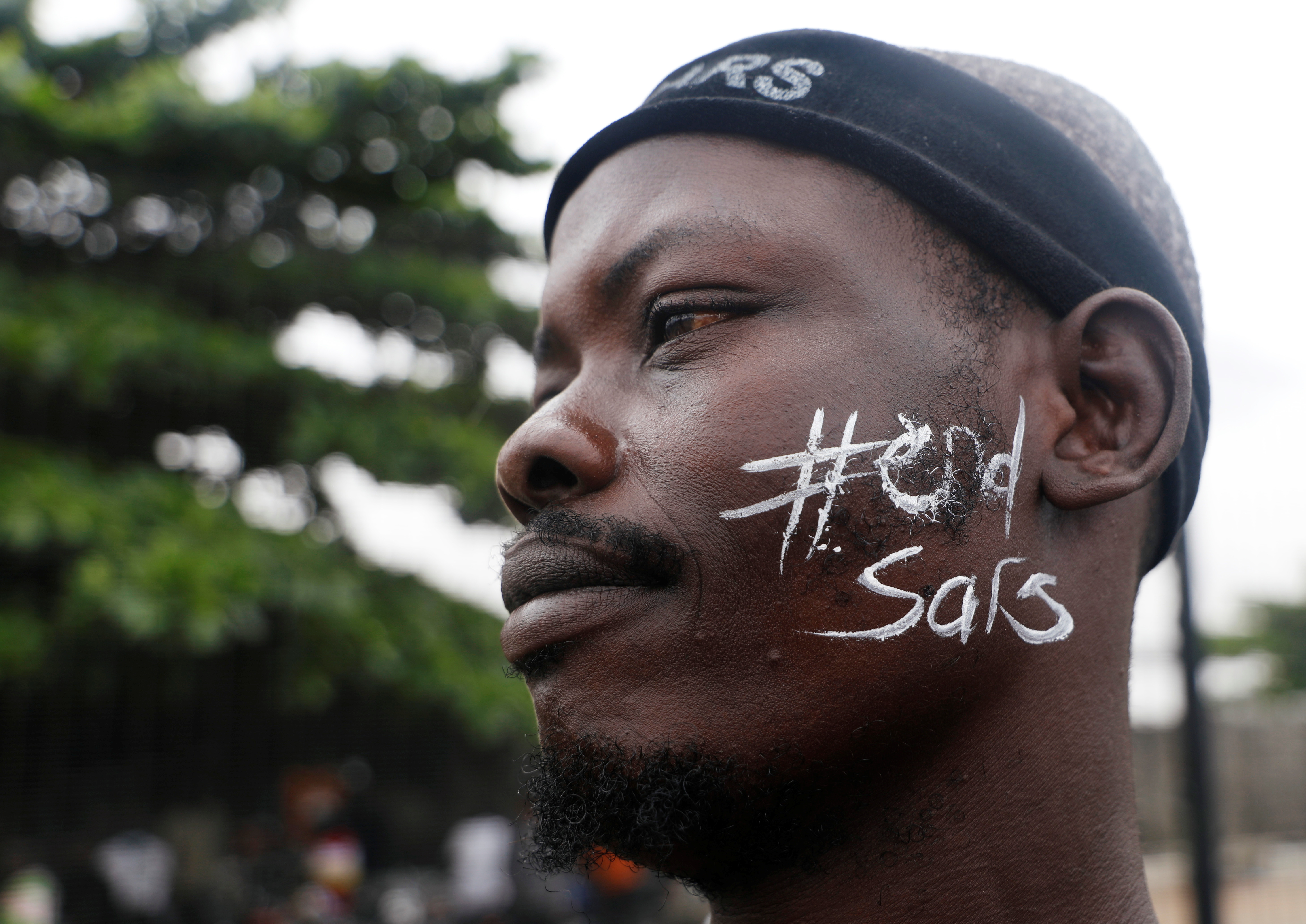 A demonstrator protests against Nigeria&#39;s Special Anti-Robbery Squad (SARS) in Lagos on October 17 [Temilade Adelaja/Reuters]