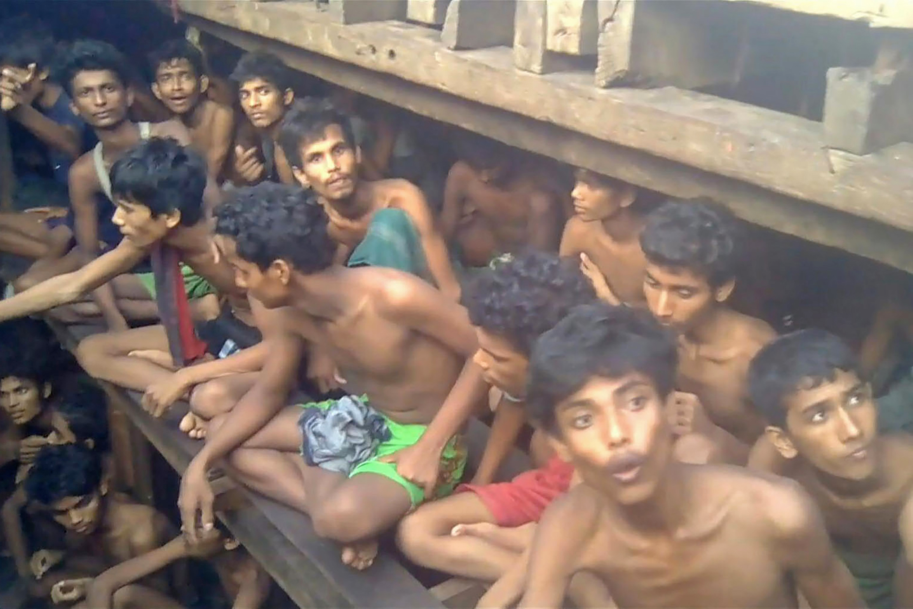 This video grab taken on December 4, 2020 from an AFPTV video shows Rohingya refugees in a boat in Chakmarkul on August 26, 2020 [AFP]