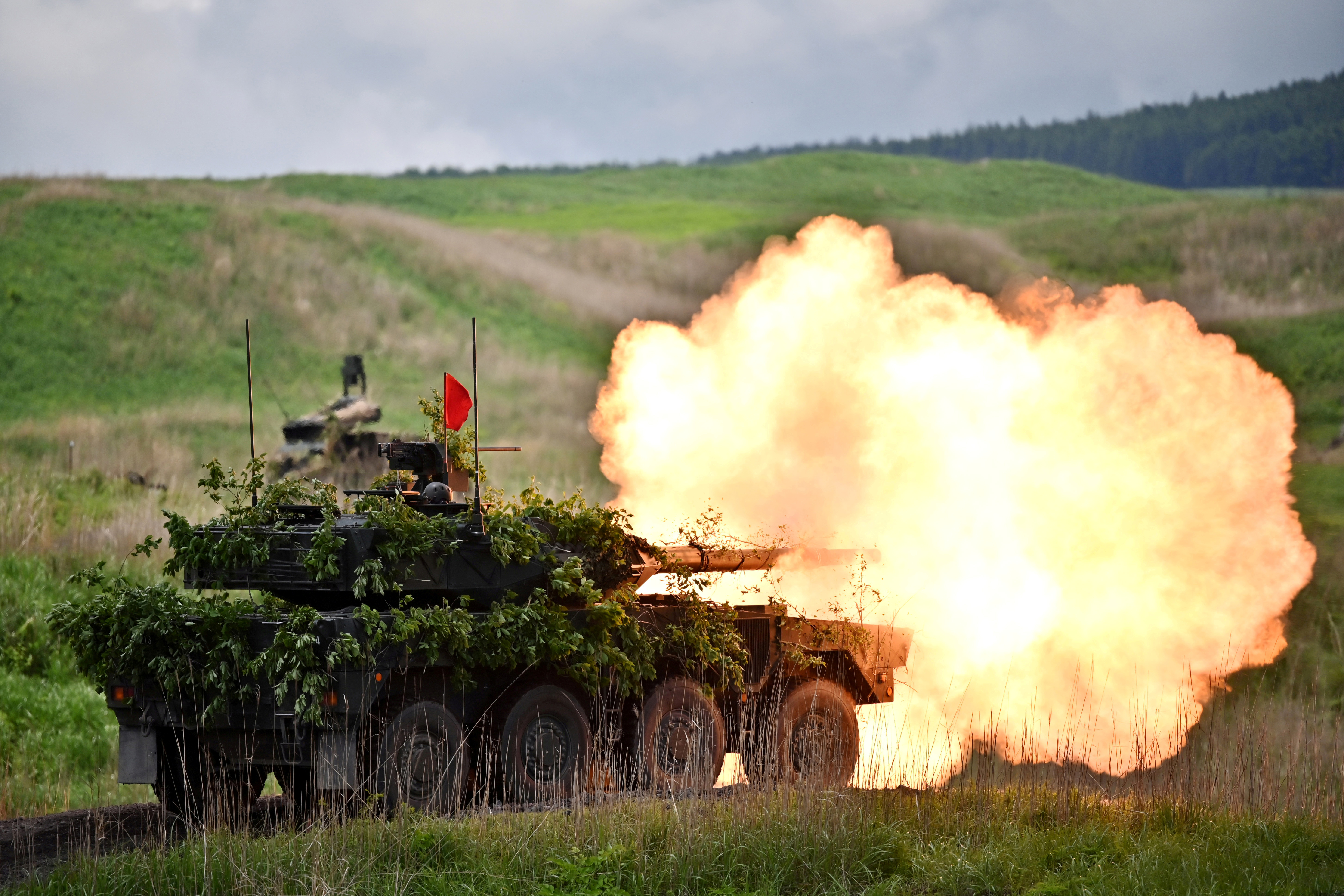 Japan has approved a ninth consecutive increase in military spending with plans to develop a stealth fighter and longer-range anti-ship missiles [File: Charly Triballeau/Pool via Reuters]