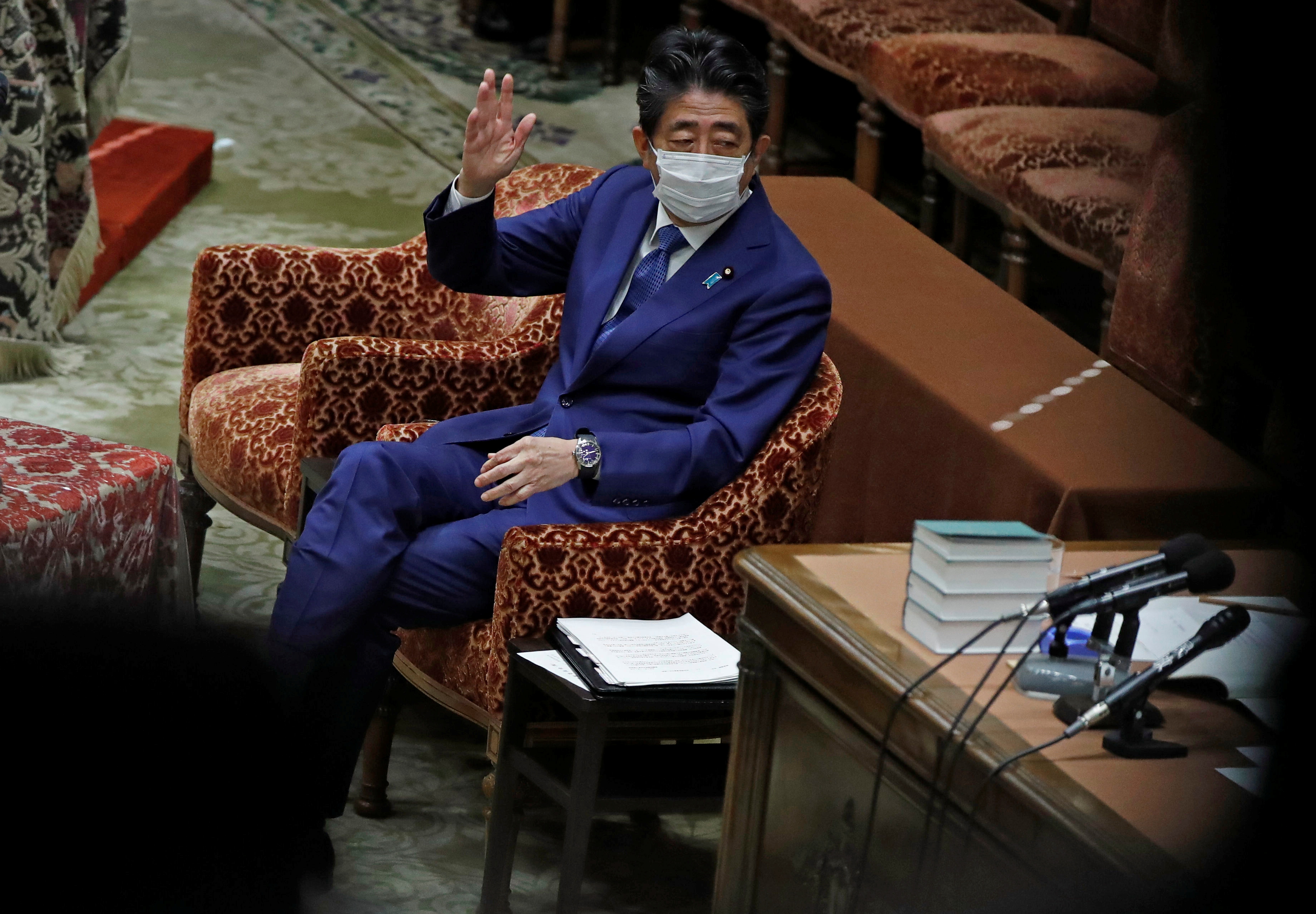 Former Japanese Prime Minister Shinzo Abe gestures while attending the lower house parliamentary session to face questioning over a possible violation of election funding laws, in Tokyo, Japan on December 25, 2020 [Issei Kato/ Reuters]