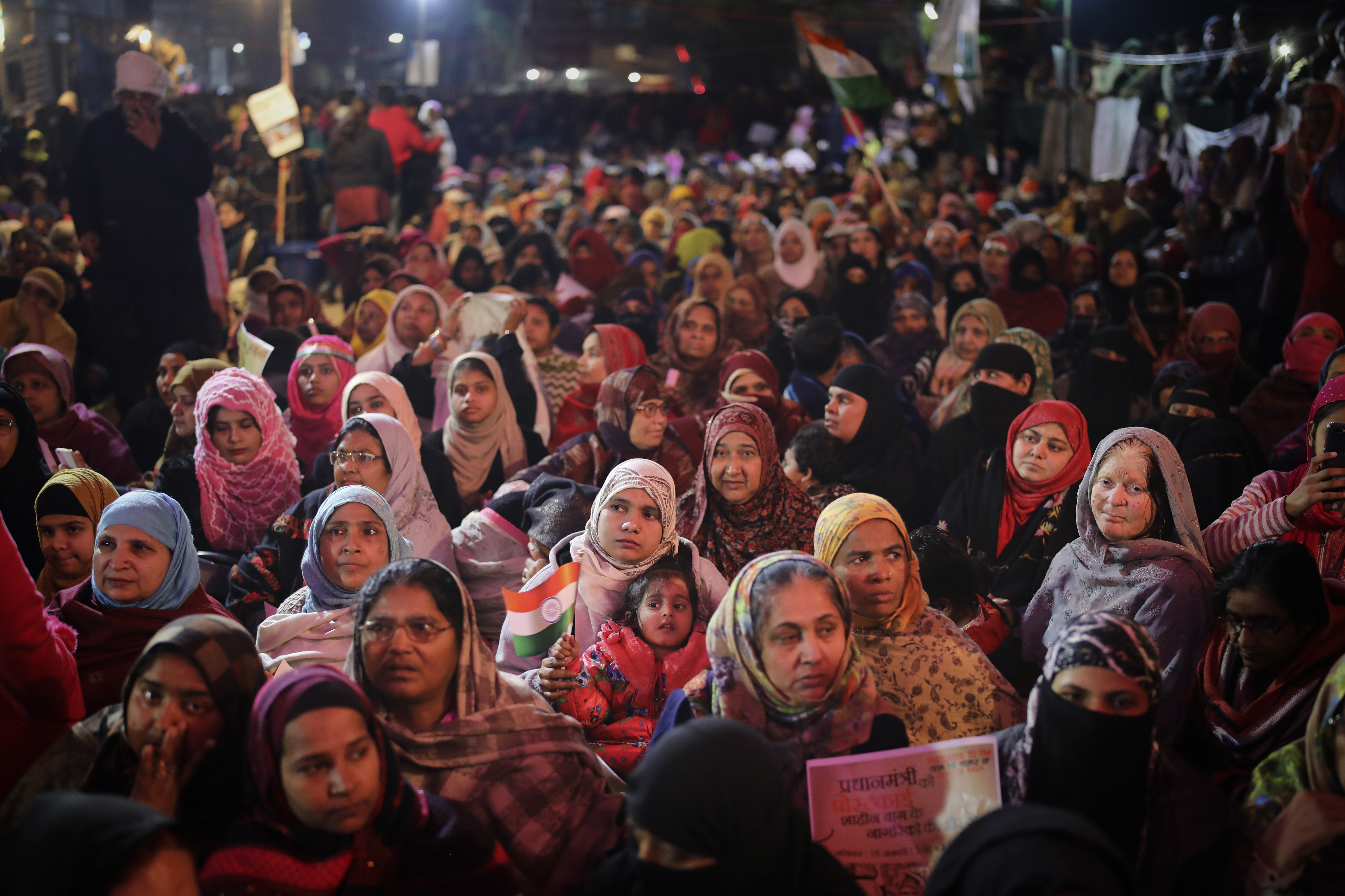 January 18: Female protesters listen to a speaker inside a tent at the protest site in New Delhi&#39;s Shaheen Bagh area. Muslim women transcended the confines of their homes to lay claim to the streets of this nondescript Muslim neighbourhood in the capital and slowly transformed it into a nerve centre of resistance against a controversial new citizenship law. The women, sitting in the middle of a major highway, took turns maintaining a round-the-clock sit-in for more than a month. [Altaf Qadri/AP Photo]