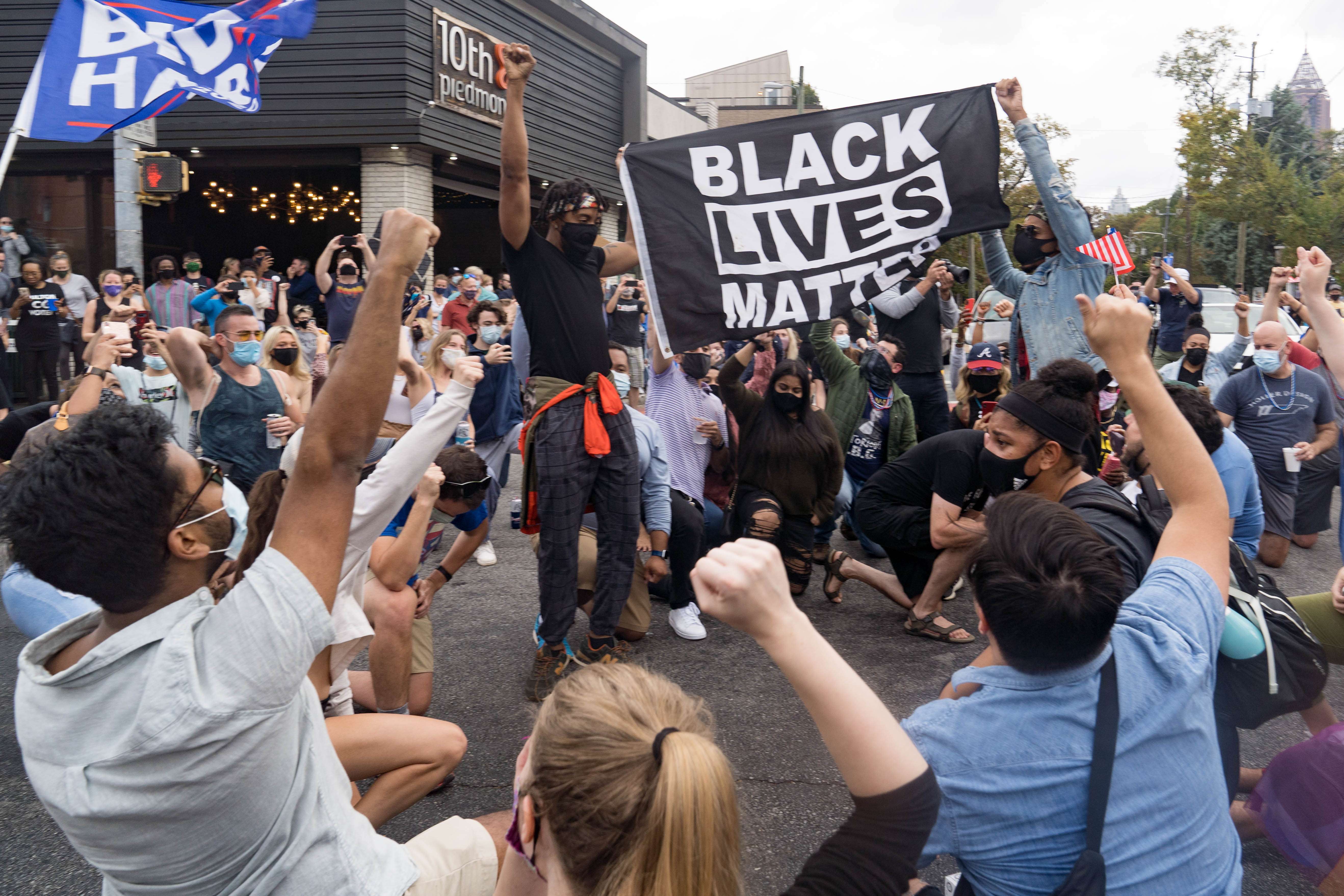 Supporters of Joe Biden celebrate his election victory at the famous rainbow intersection on November 7, 2020 in Atlanta, Georgia [Megan Varner/Getty Images/AFP]