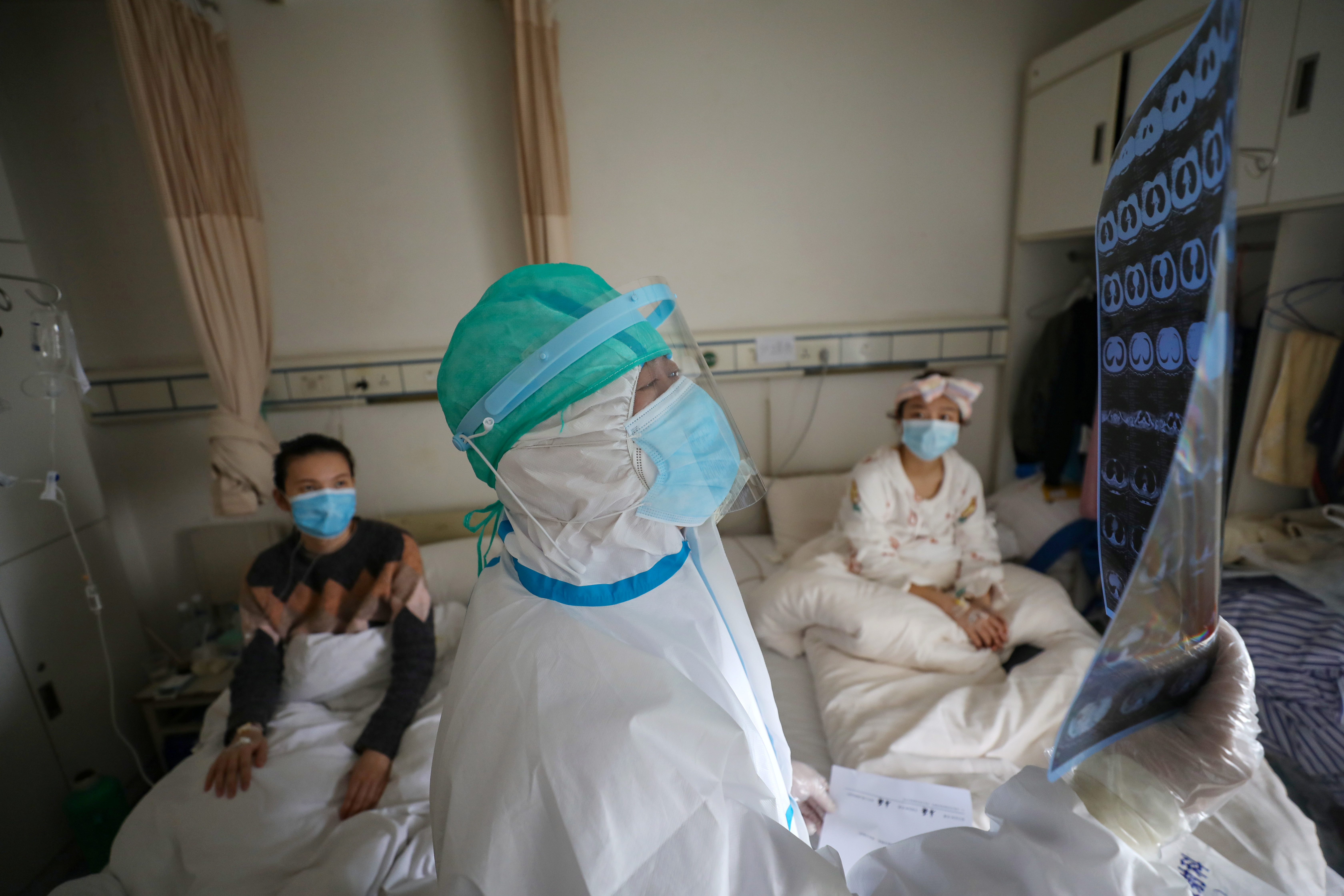 The WHO team is due to visit China and the city of Wuhan, as it investigates the origins of a pandemic in which nearly 1.9 million people have now died [File: China Daily via Reuters]