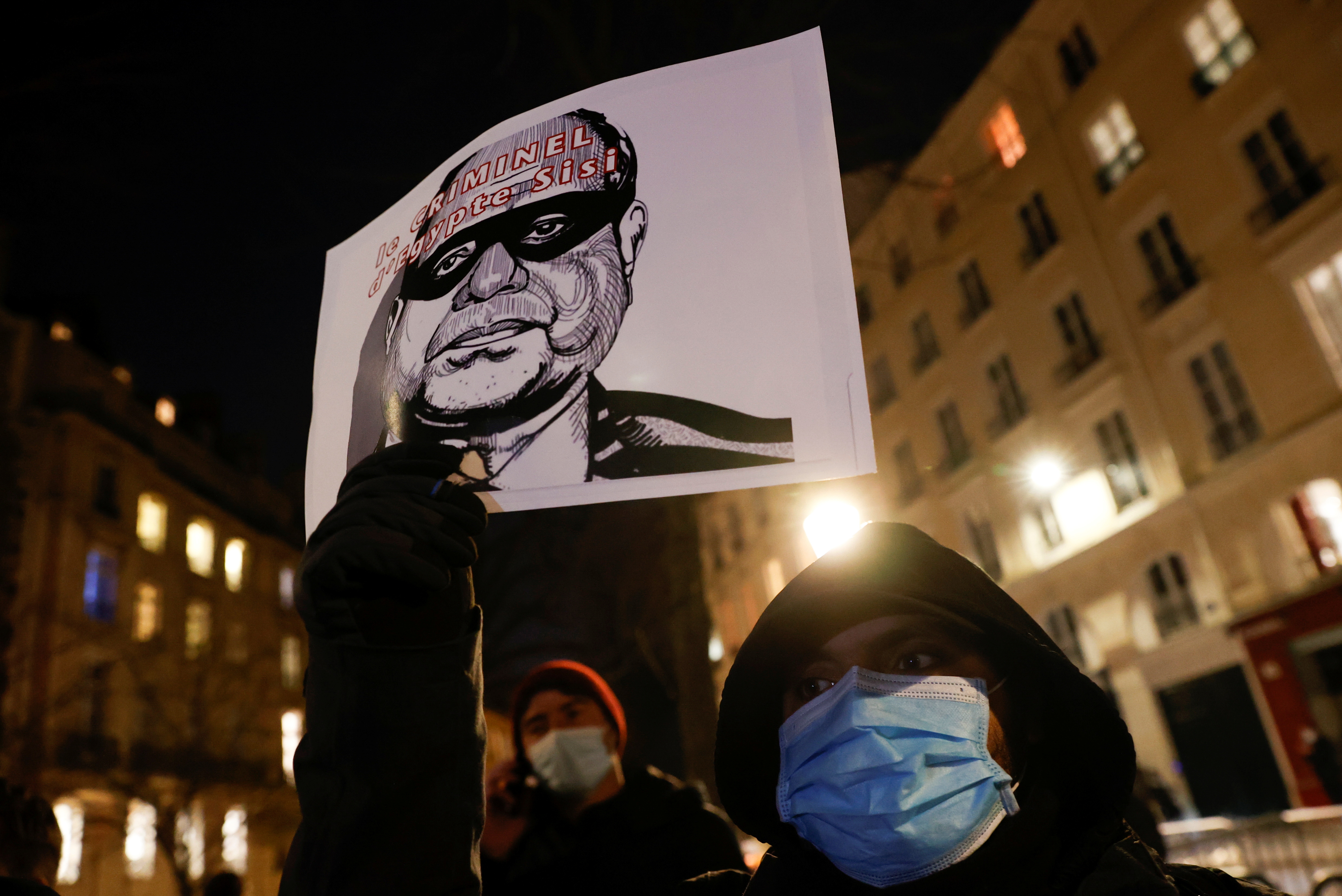 Human rights activists stage a protest over human rights violations in Egypt during a two-day official visit of Egyptian President Abdel Fattah el-Sisi in Paris, France in December 2020 [File: Christian Hartmann/Reuters]