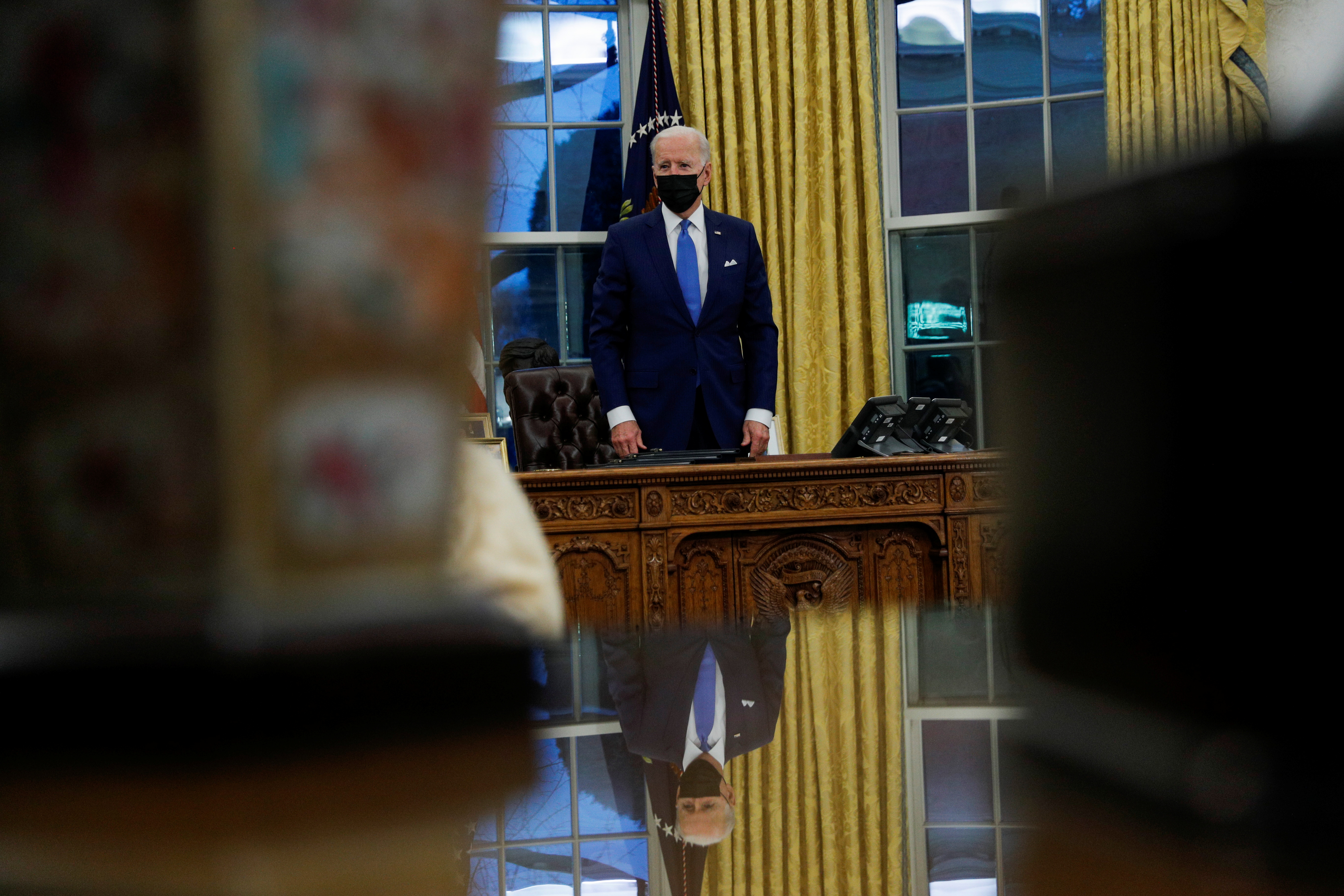 President Joe Biden on Tuesday signed executive orders aimed at undoing some of Donald Trump&#39;s most hardline immigration policies [Tom Brenner/Reuters]