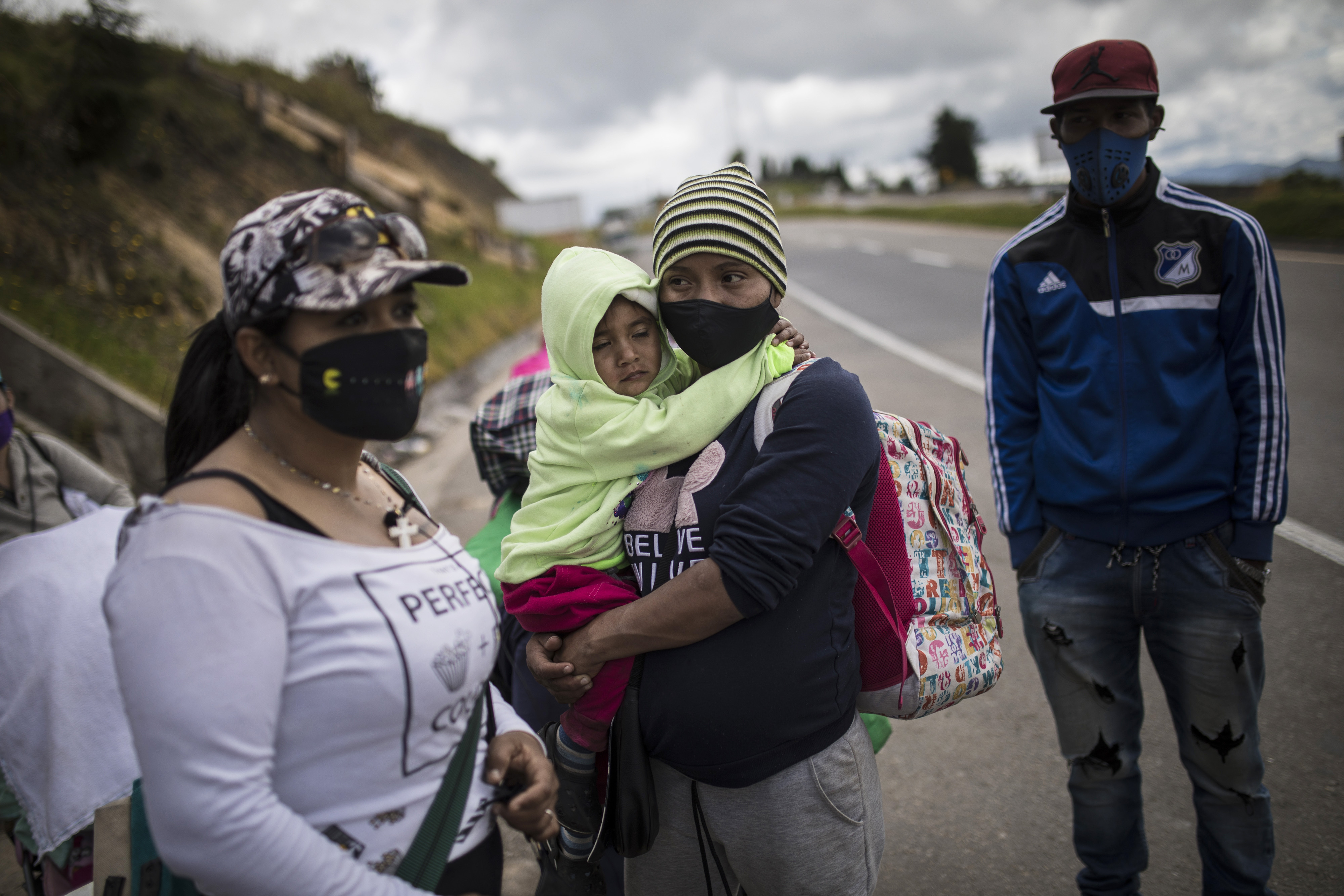Venezuelan migrants rest as they walk towards Bogota, passing through Tunja, Colombia, on Tuesday, October 6, 2020 [Ivan Valencia / AP Photo]