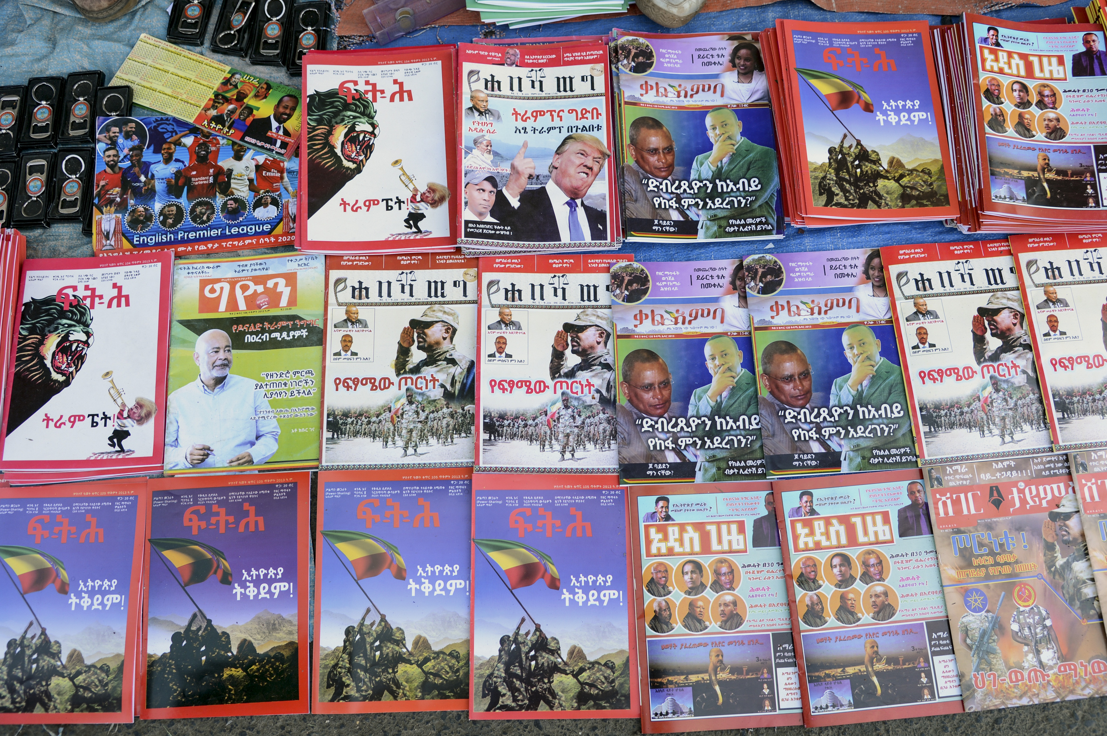 Newspapers and magazines reporting on Ethiopia&#39;s Tigray conflict seen at a news stand in Addis Ababa on November 7, 2020 [File: Samuel Habtab/AP Photo]