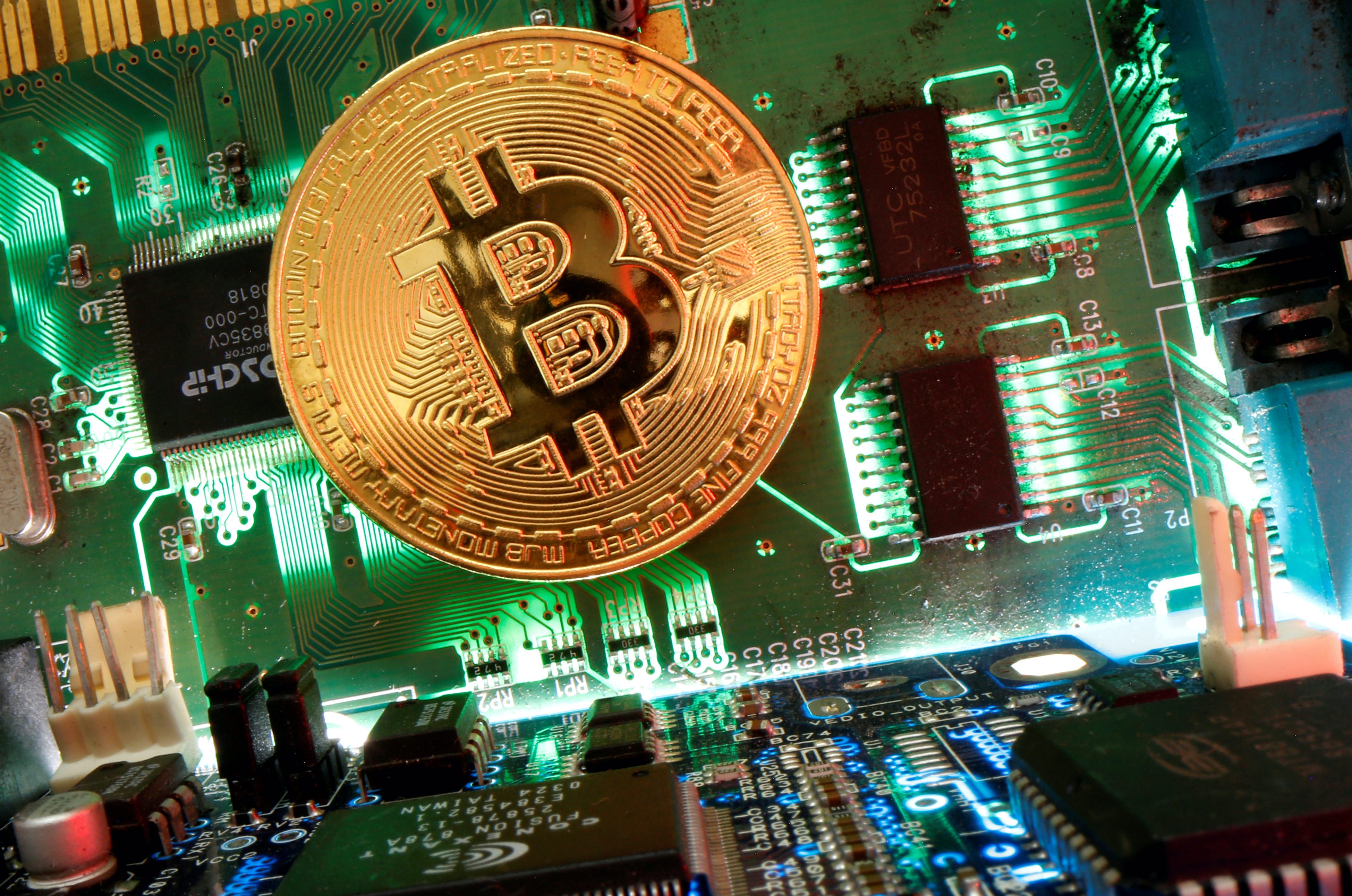 Both Bitcoin and Ether have bounced back somewhat after Wednesday's massive selloff, but a planned crackdown on crypto mining and trading by China as well as an announcement from the United States that it plans to tax crypto transfers above $10,000 both sent prices wobbling [File: Dado Ruvic/Illustration/Reuters]