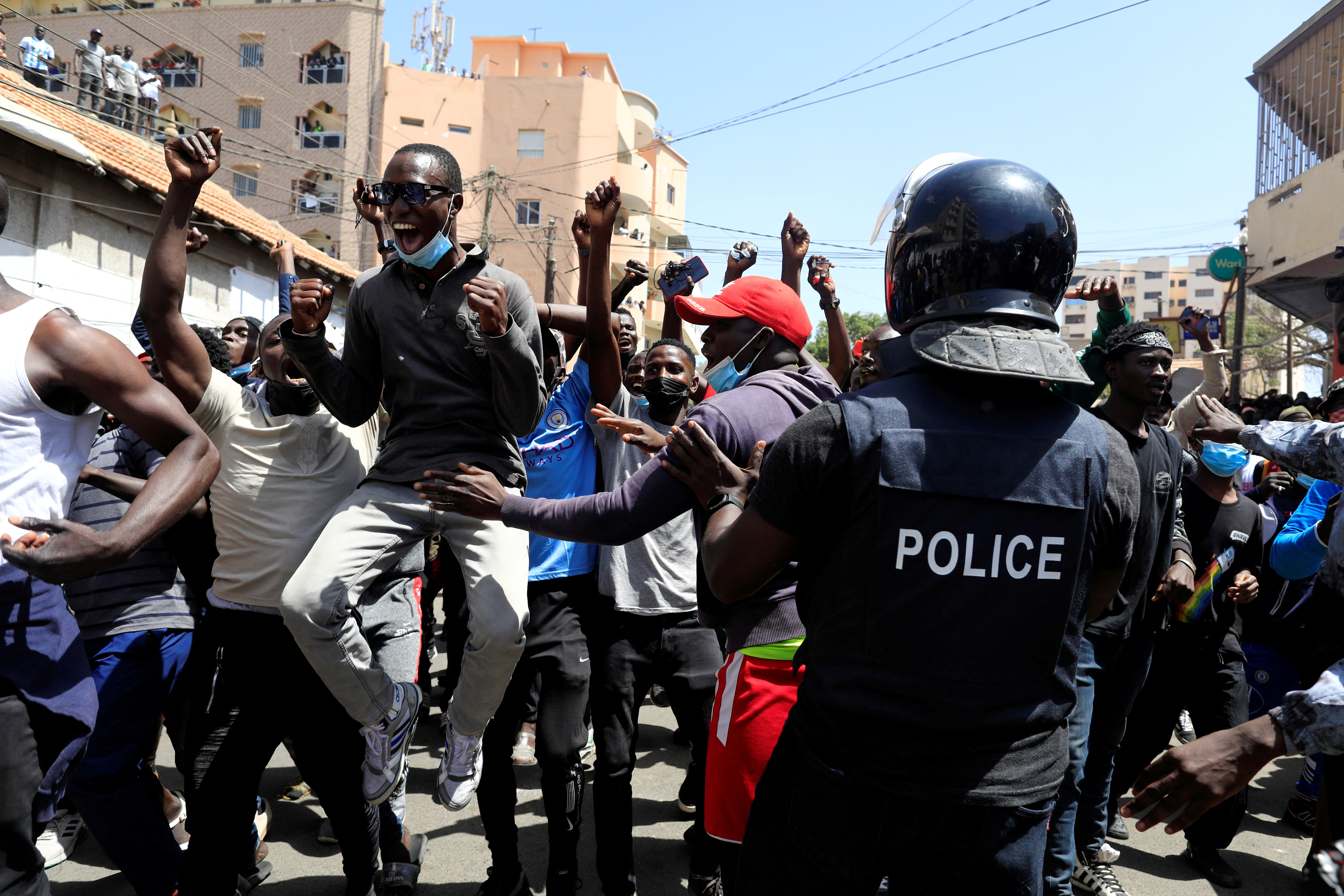Supporters of opposition leader Ousmane Sonko, who was arrested on sexual assault accusations, celebrate his release in front of the court in Dakar [Zohra Bensemra/Reuters]