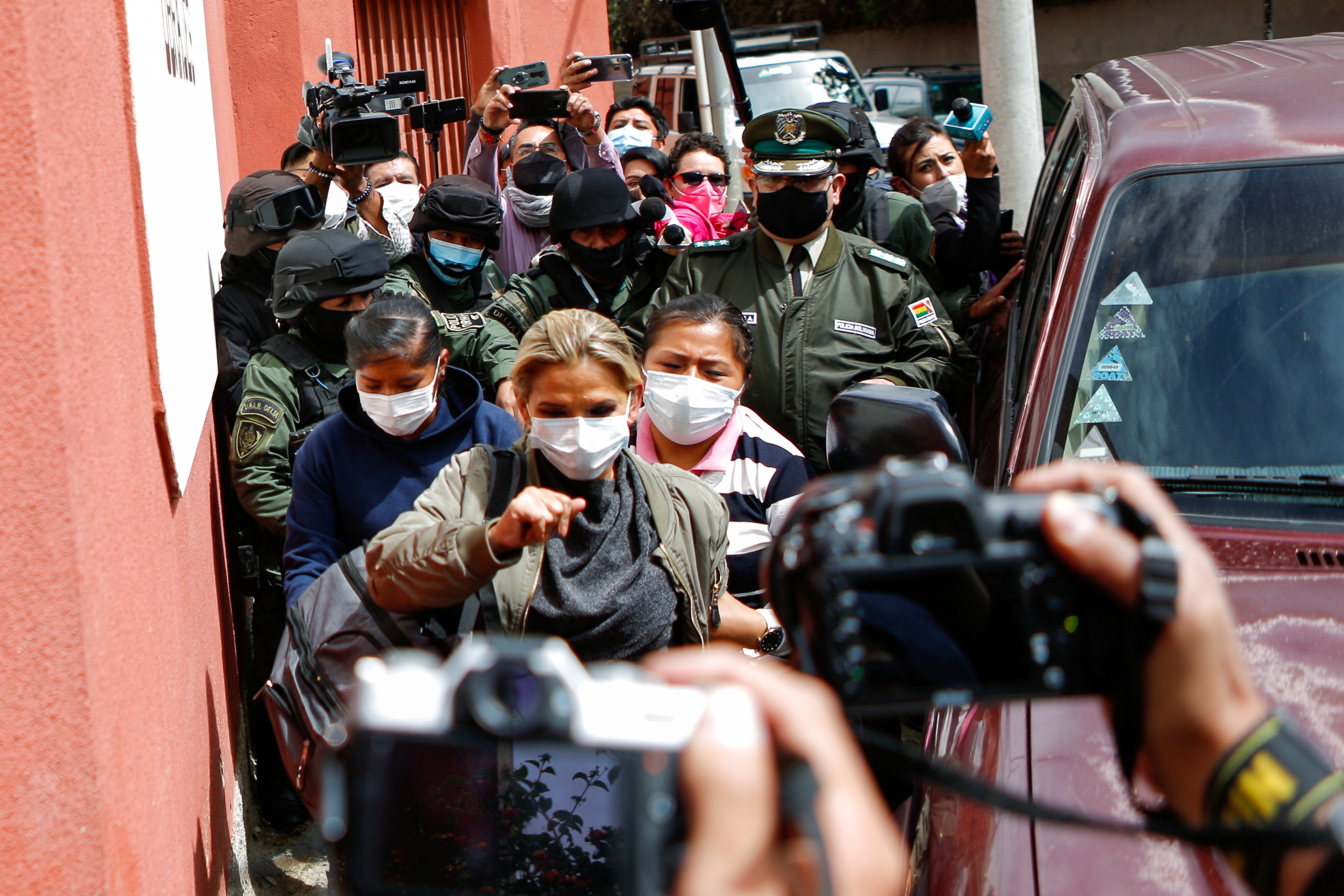 Bolivia&#39;s former interim President Jeanine Anez arrives at a women&#39;s jail after leaving the FELCC (Special Force to fight against Crime) headquarters, in La Paz, Bolivia, March 15, 2021 [Manuel Claure/Reuters]