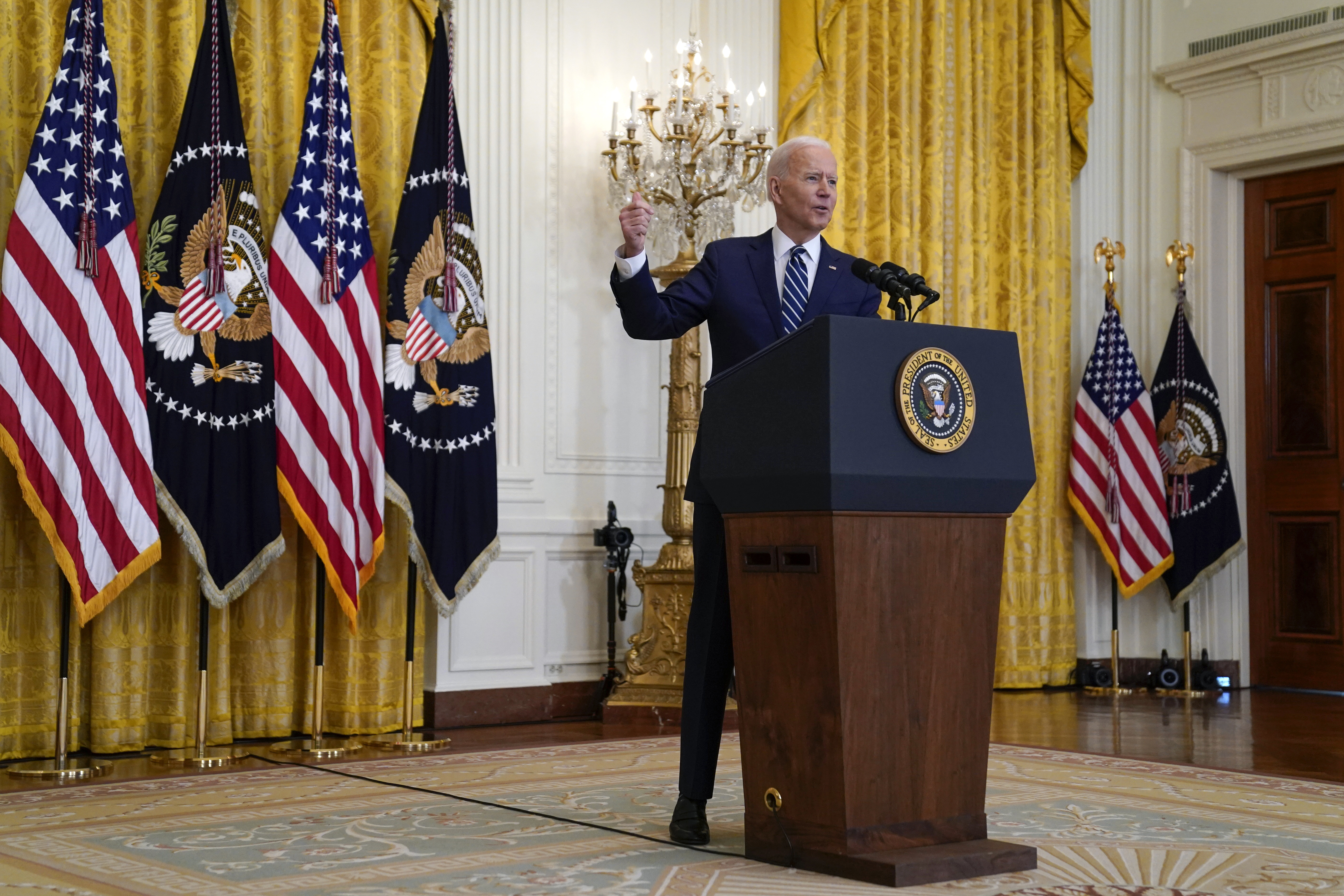 Biden speaks during a news conference in the East Room of the White House [Evan Vucci/AP]