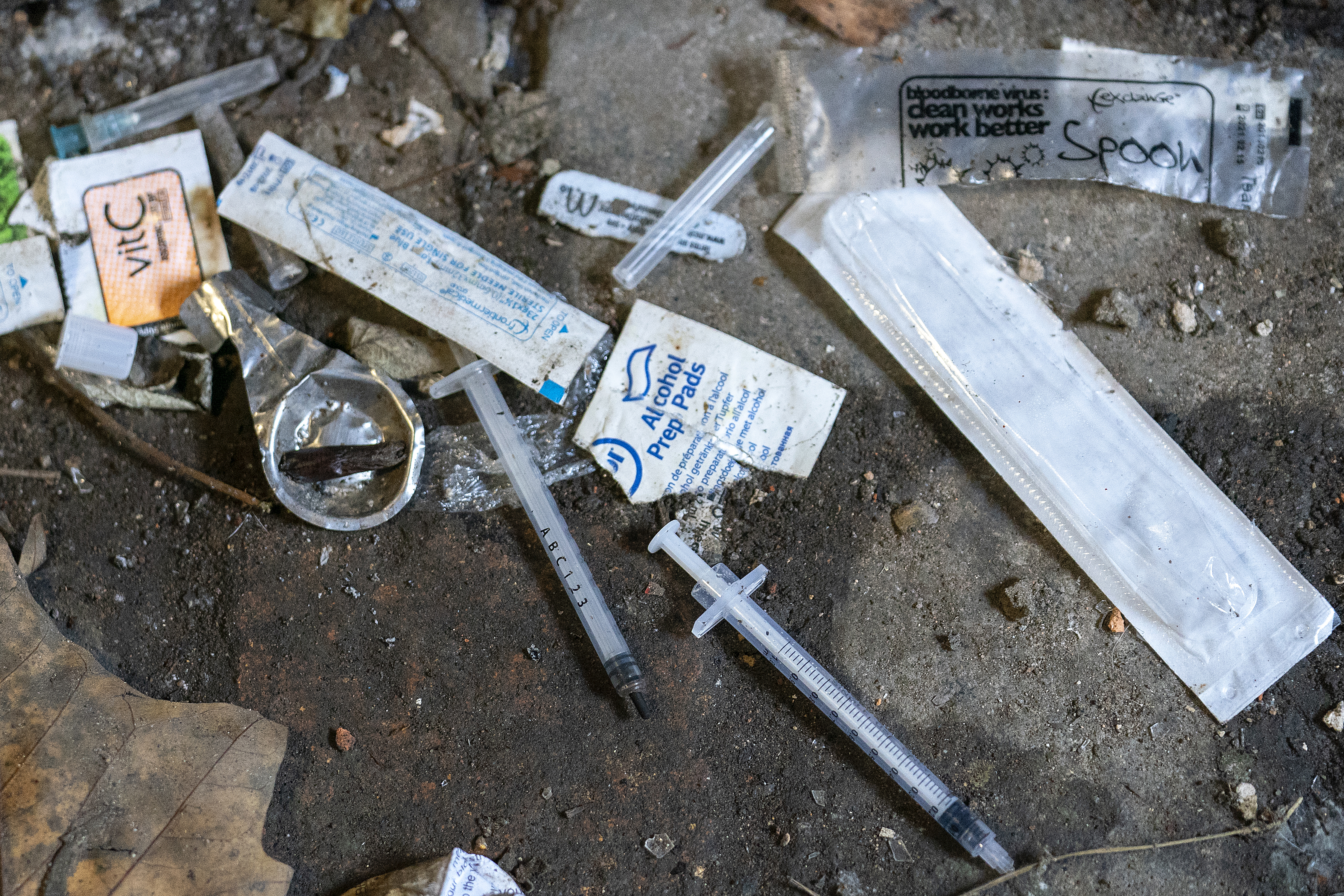 Syringes and paraphernalia used by drug users litter an alley way in Walsall Town Centre on December 6, 2018 in Walsall, England [Christopher Furlong/Getty Images]