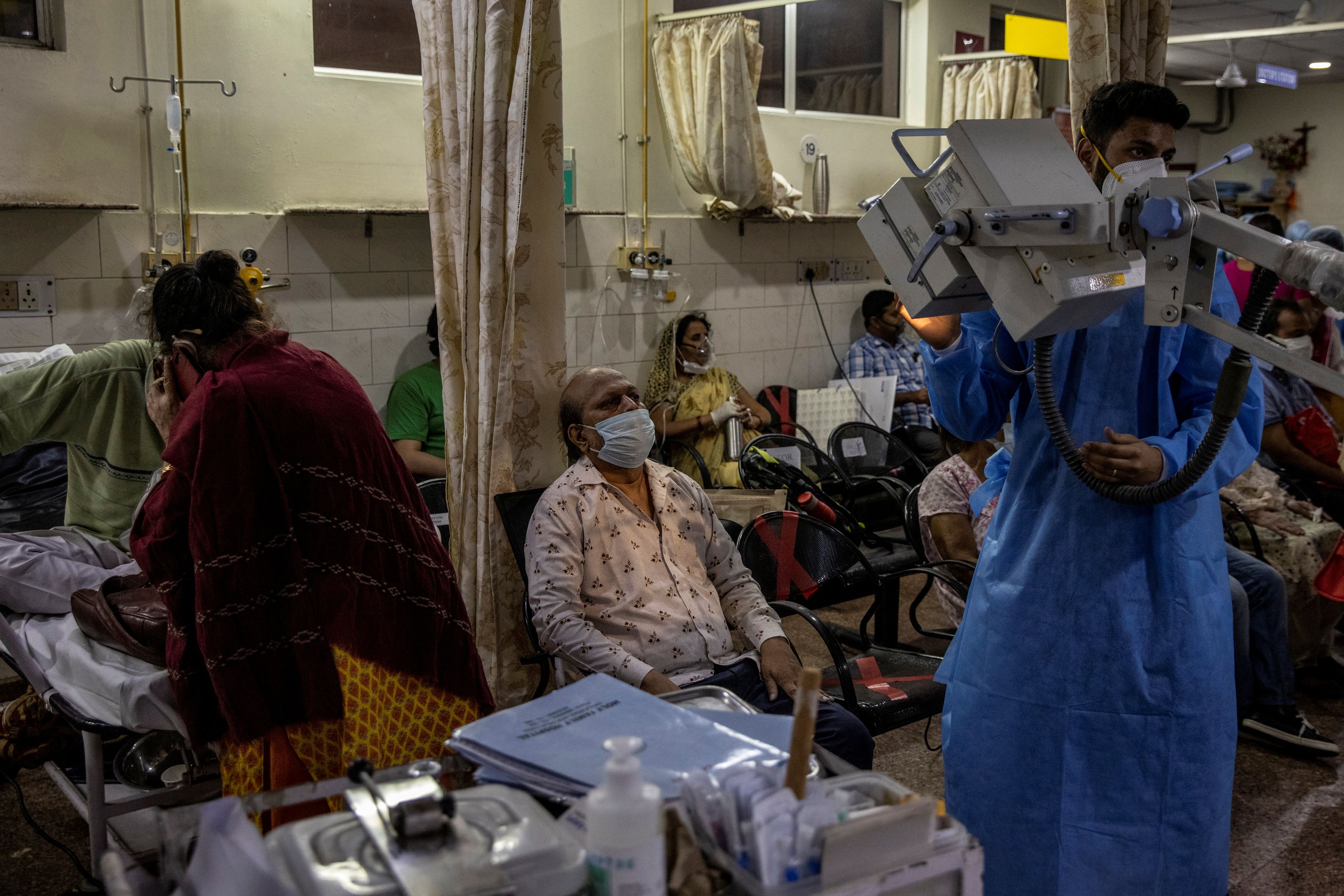 Patients suffering from COVID-19 receive treatment at the emergency ward of a hospital in New Delhi, India, on April 29, 2021 [Reuters/Danish Siddiqui]