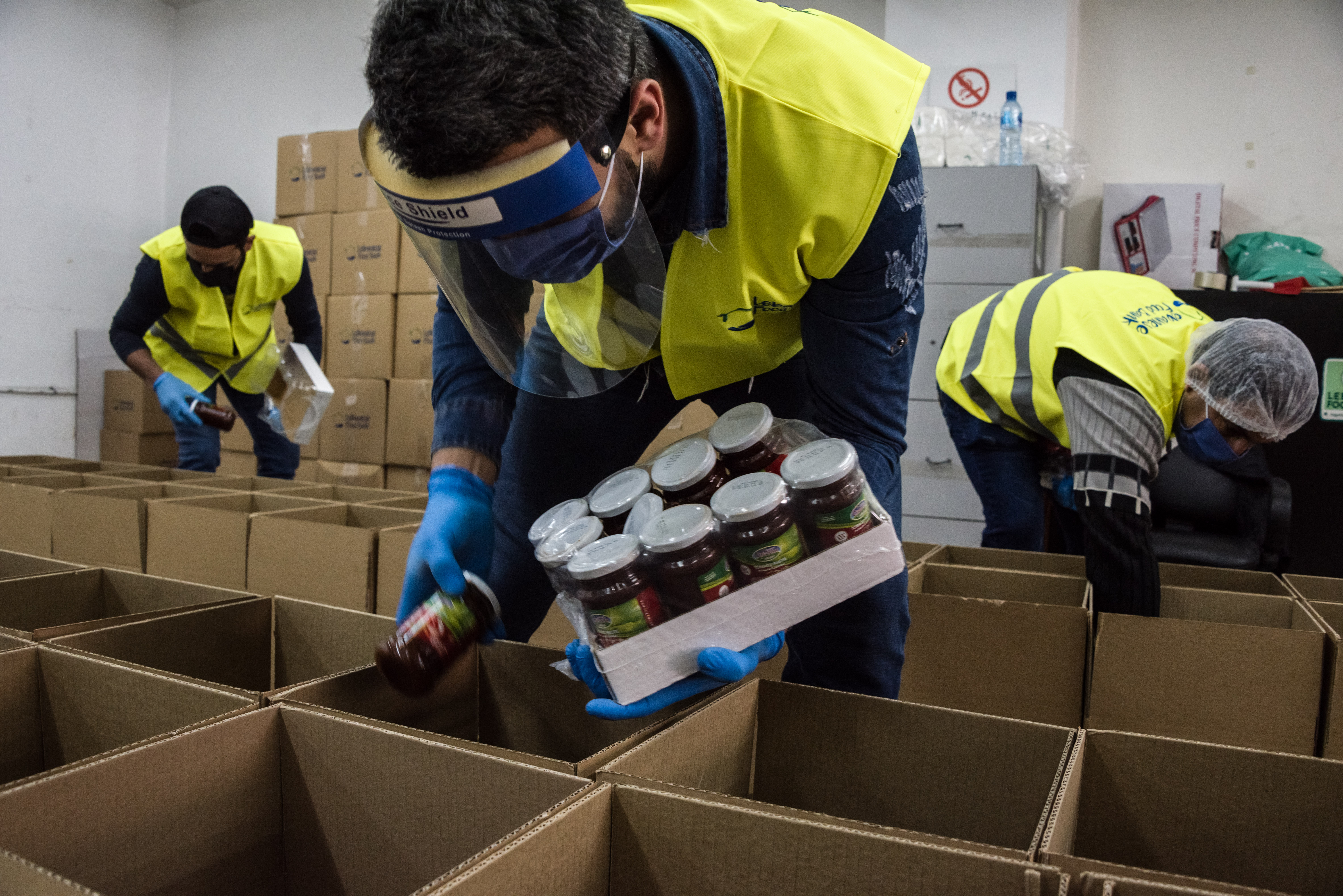 Lebanese Food Bank staff pack boxes distributed to needy families during the struggling country&#39;s economic crisis [Courtesy: Lebanese Food Bank]