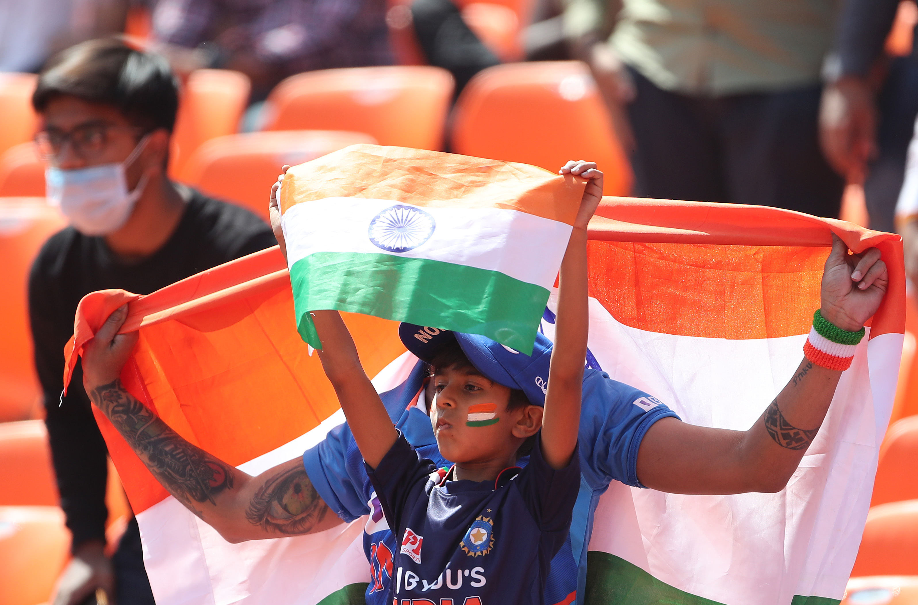 A fan watches the Test match between India and England at the Narendra Modi Stadium [File: Surjeet Yadav/Getty Images]
