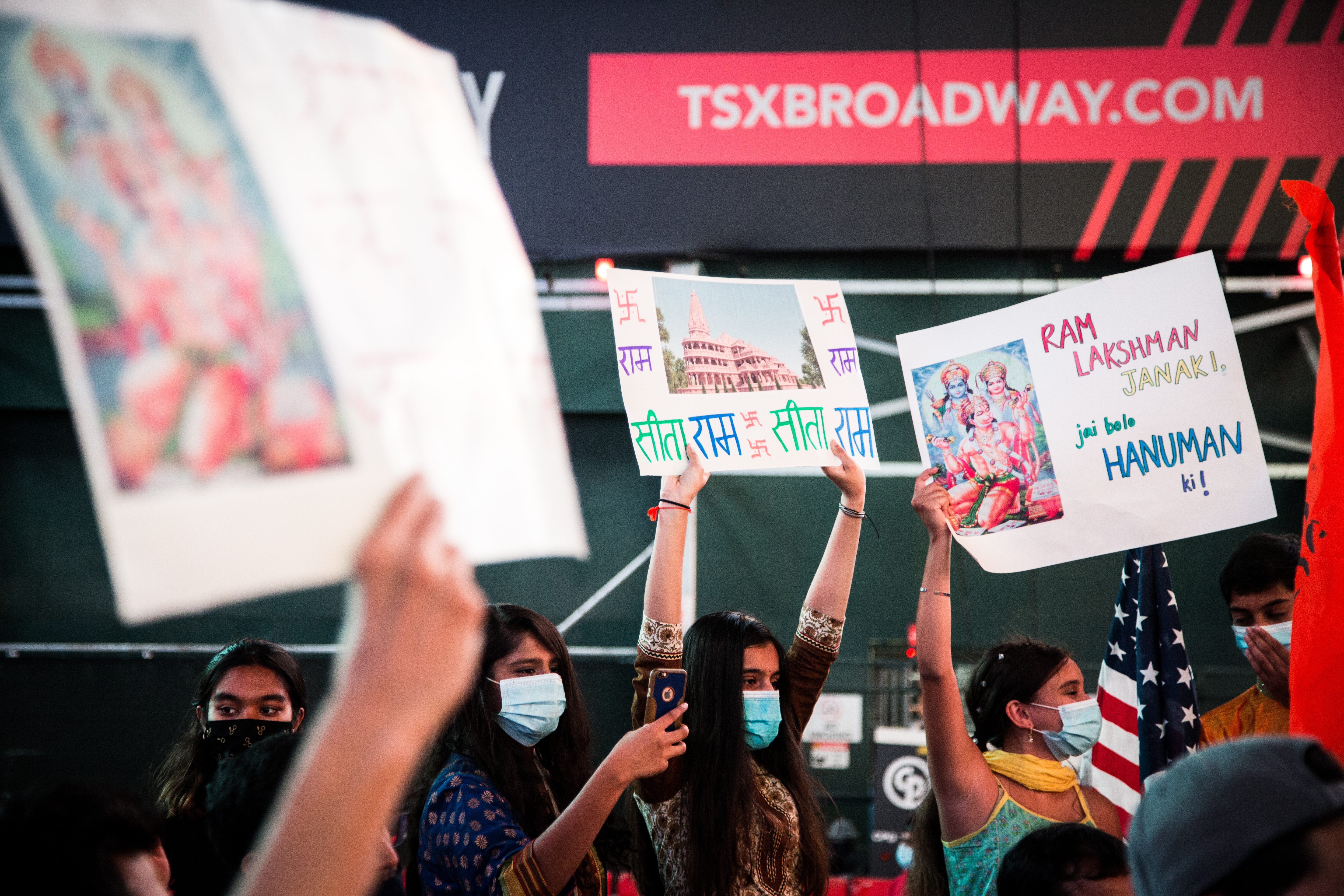 People in New York celebrate the groundbreaking for a Hindu temple in the Indian city of Ayodhya [File: Alba Vigaray/EPA]