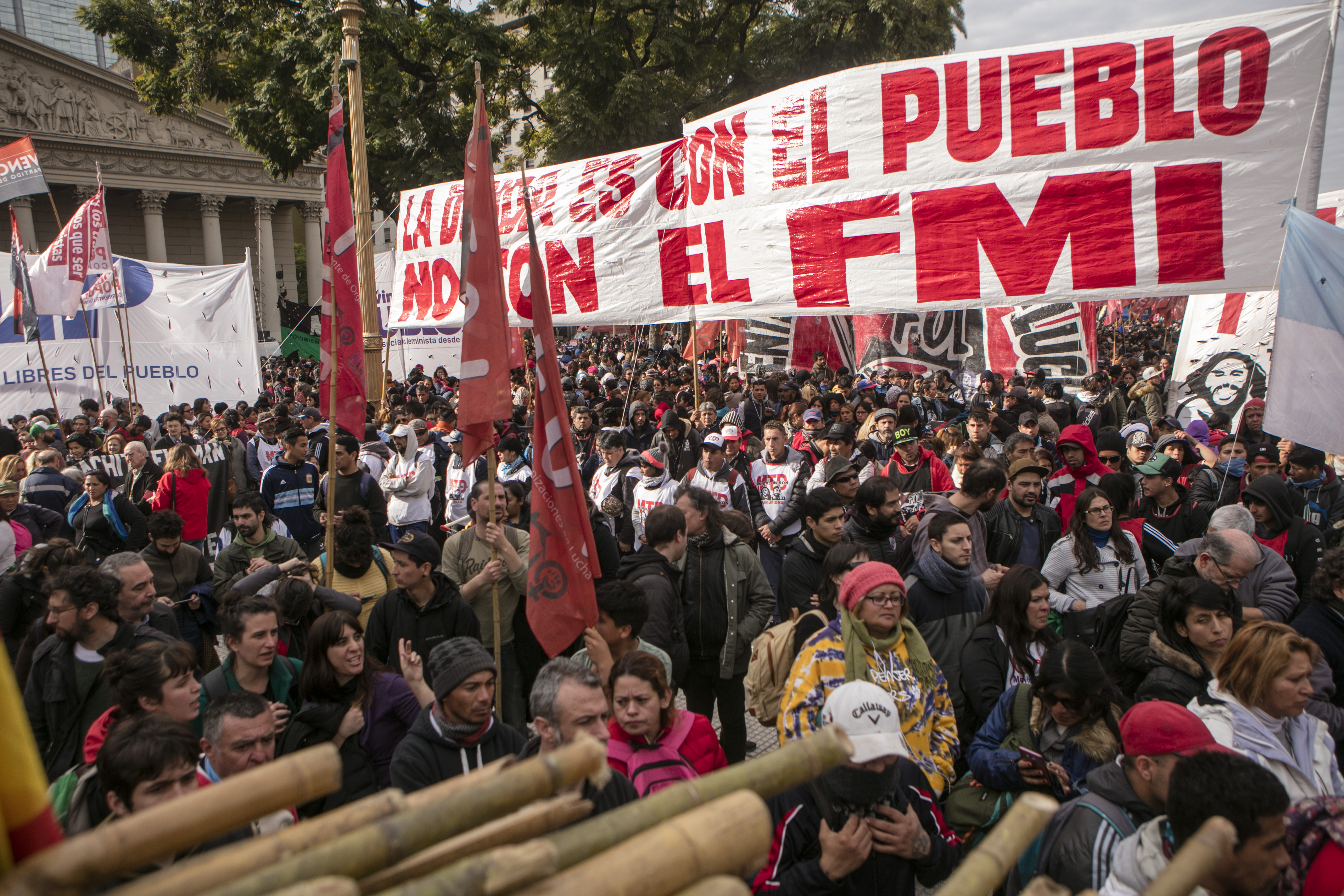 Protesters show a sign that reads &#39;The debt is with the people, not the IMF&#39; during a demonstration at Plaza de Mayo on August 15, 2019, in Buenos Aires, Argentina [Ricardo Ceppi/ Getty Images]