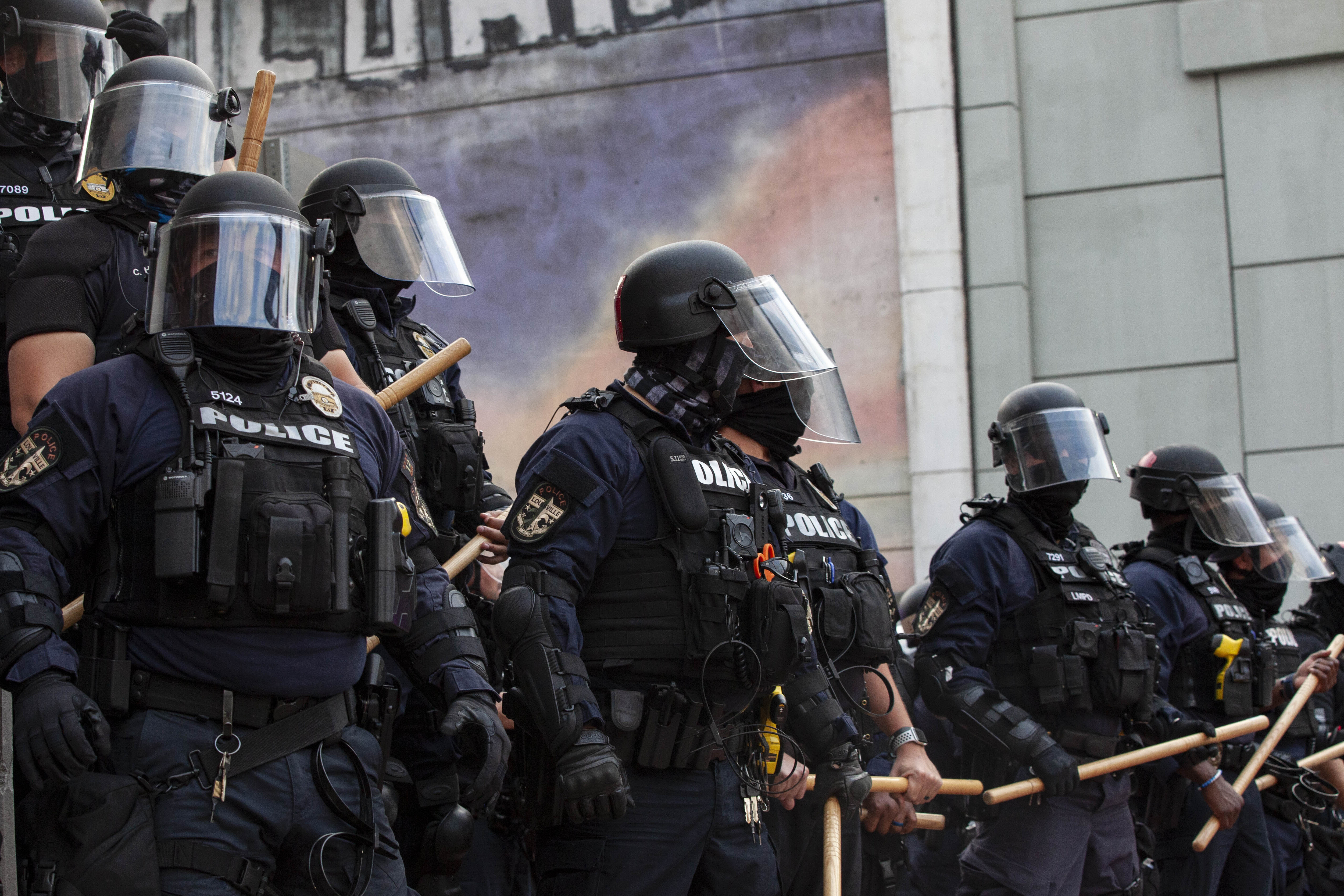 Law enforcement block protesters marching against the Grand Jury decision to only indict one of the three police officers who fired into Breonna Taylor&#39;s home in Louisville, Kentucky in 2020 [File: Stephen Zenner/SOPA Images/LightRocket via Getty Images]