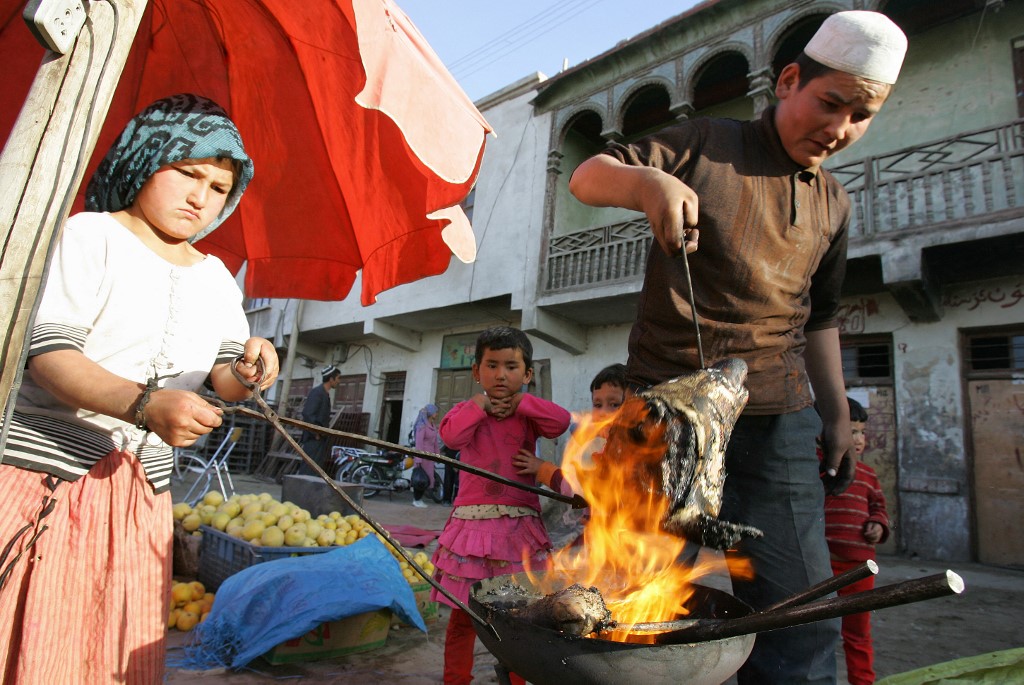 The Uighurs have been practising Islam for centuries, tracing their religious influence to the Karakhanid, a Turkic fiefdom that ruled Central Asia from the 9th to the 13th century [File: Frederic J Brown/AFP]