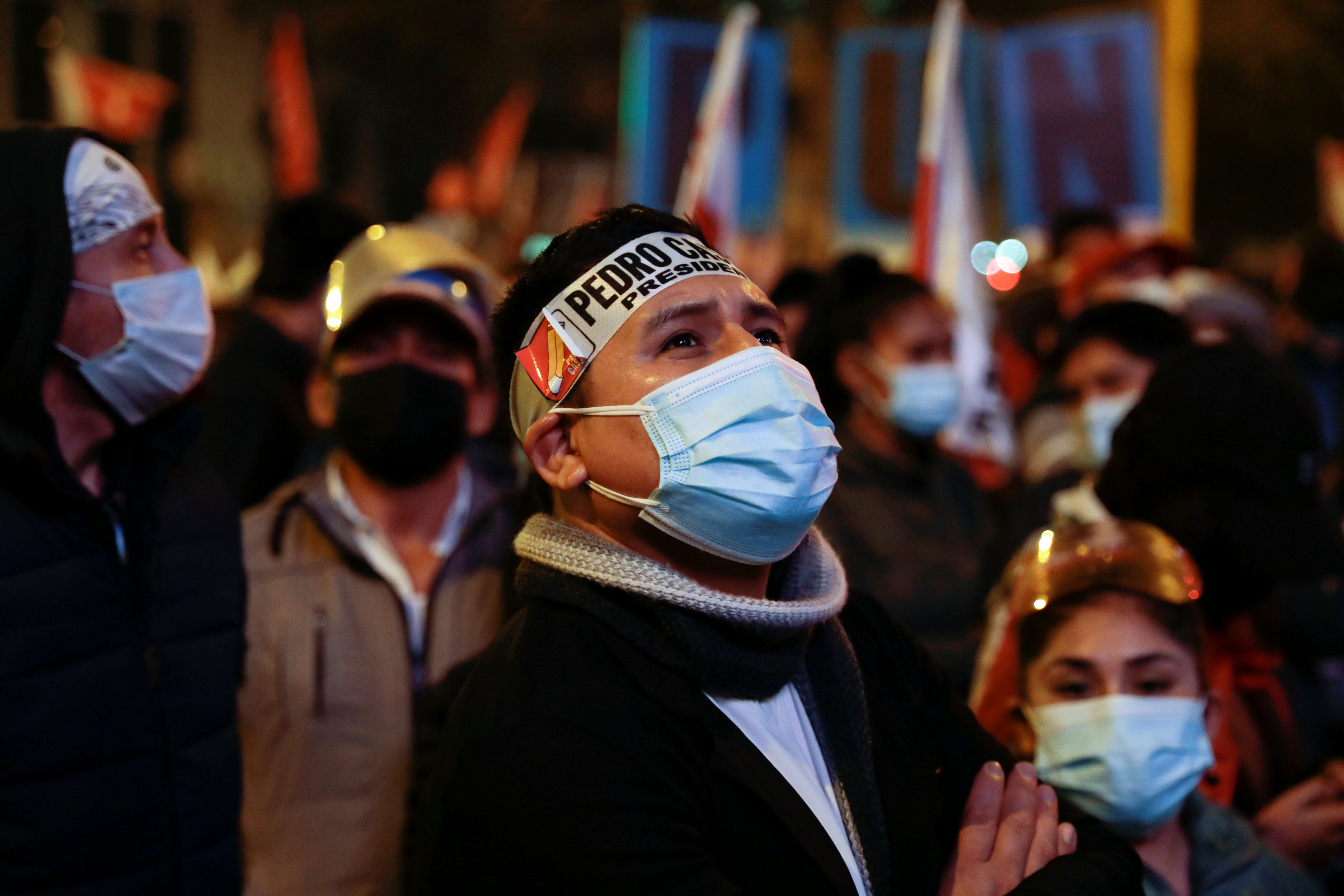 Supporters of Peru&#39;s presidential candidate Pedro Castillo gathering outside the headquarters of the Free Peru party, in Lima, Peru [Alessandro Cinque/Reuters]