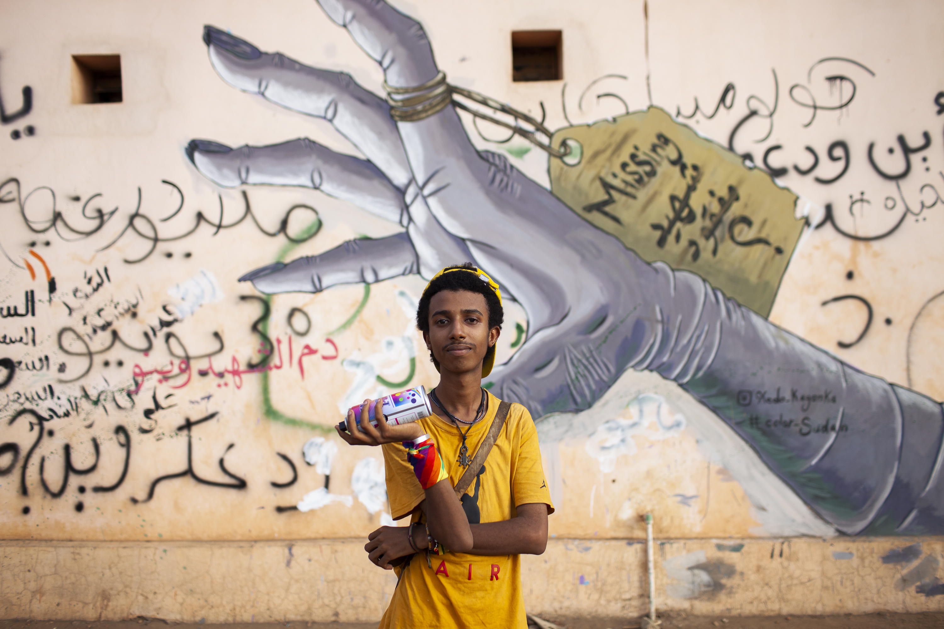 Medo Kagonka is a graffiti artist who became known for his provocative murals during the 2019 revolution, including this one on the wall of the city&#39;s morgue [Matteo Lonardi/Al Jazeera]