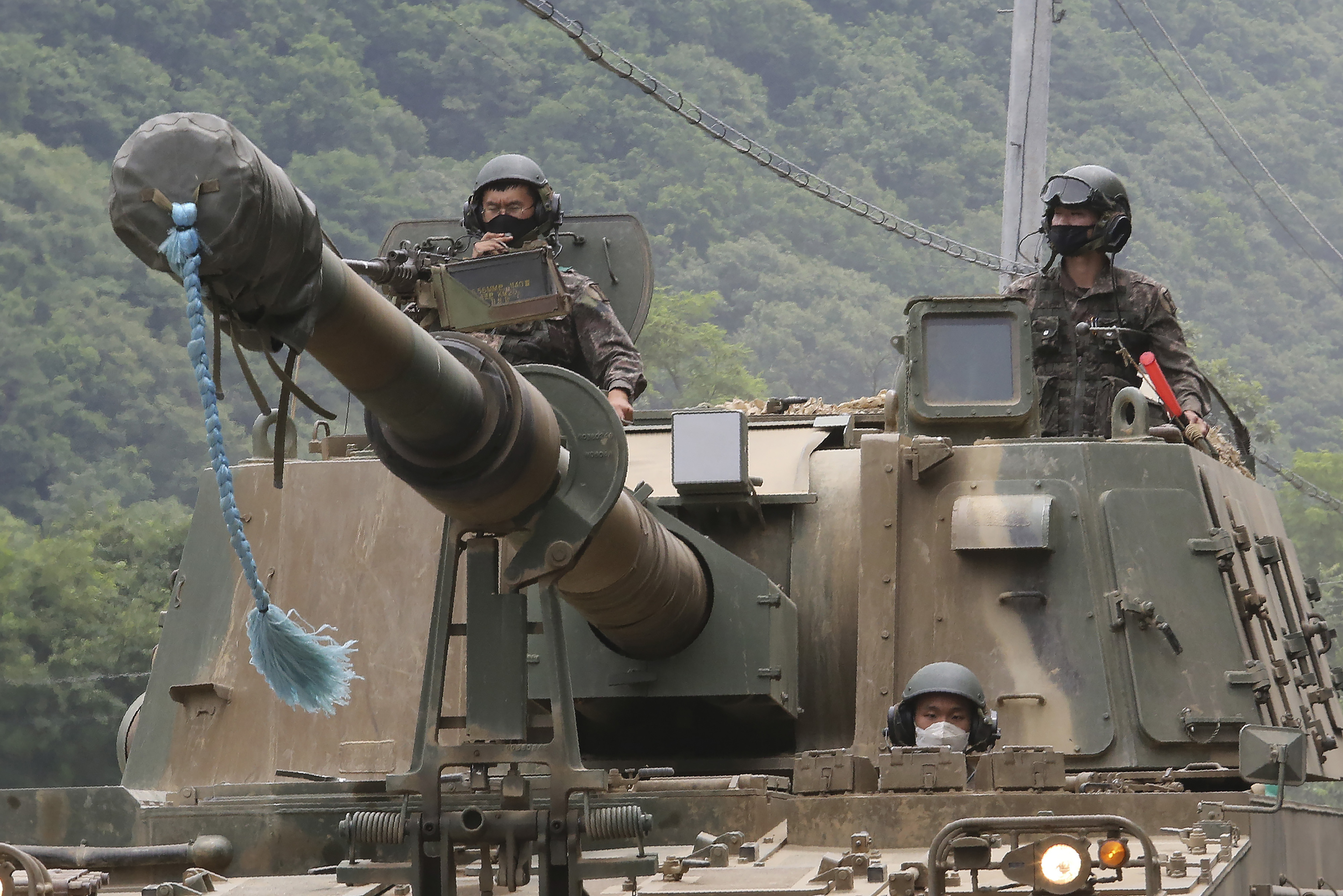 South Korean army soldiers ride a K-9 self-propelled howitzer during an annual exercise in Paju, South Korea, near the border with North Korea last June [File: Ahn Young-joon/AP Photo]
