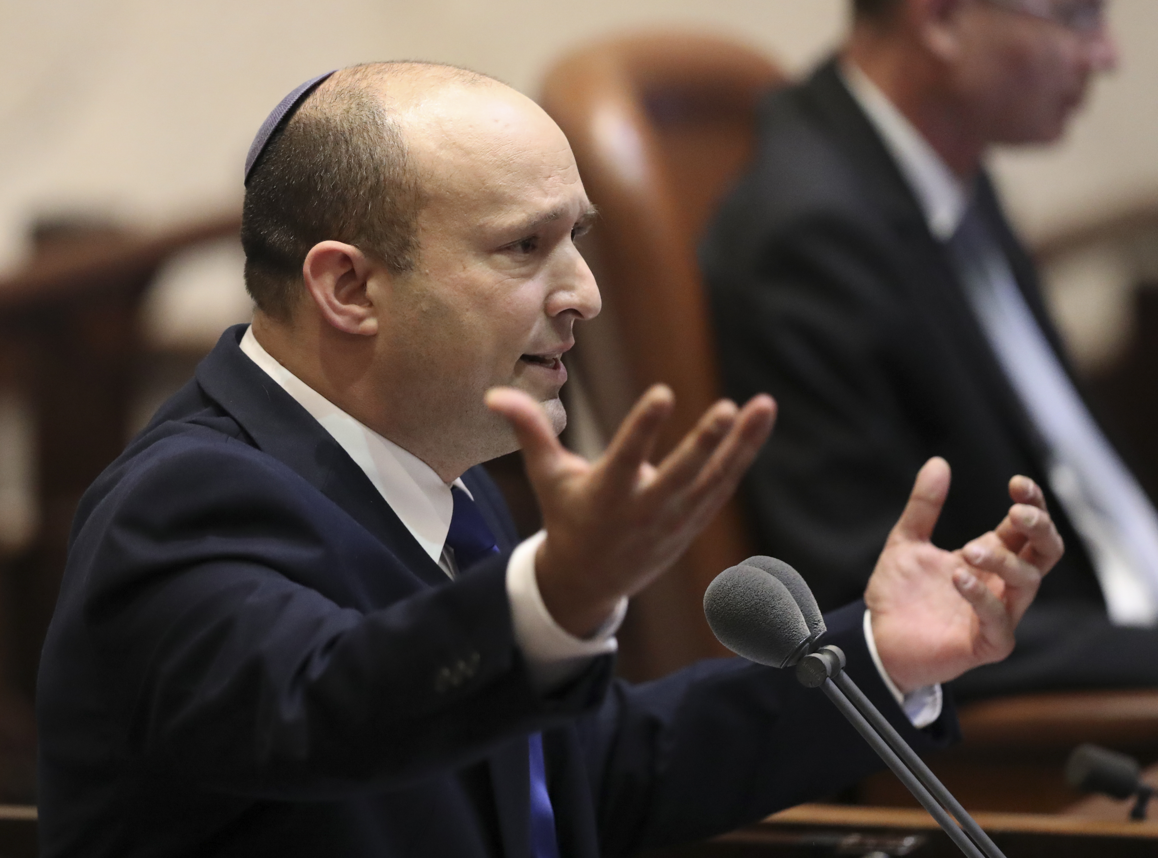 Naftali Bennett speaks during a Knesset session.