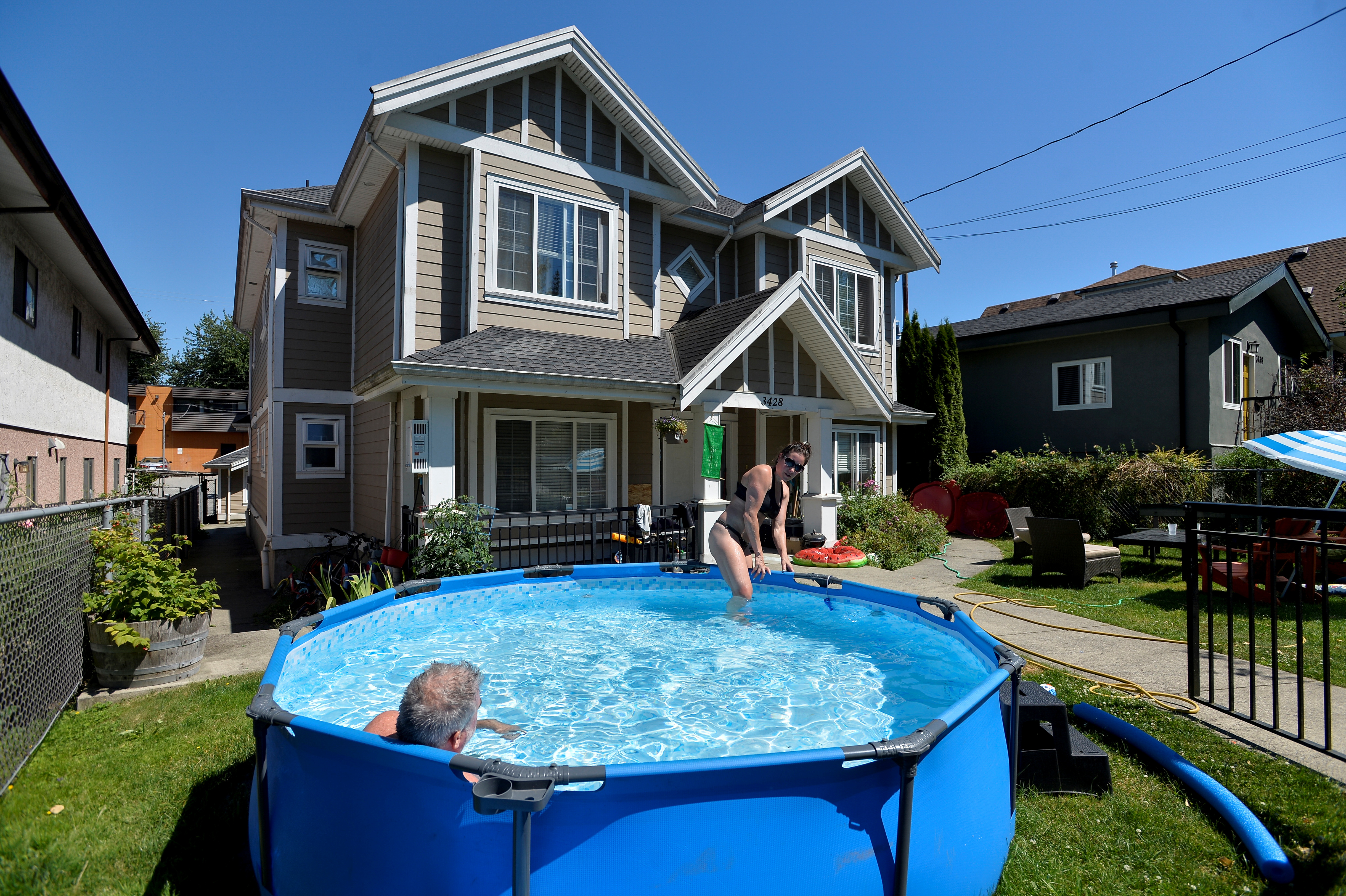 Canadians try to cool down during the scorching weather in Vancouver, British Columbia, on Monday [Jennifer Gauthier/Reuters]